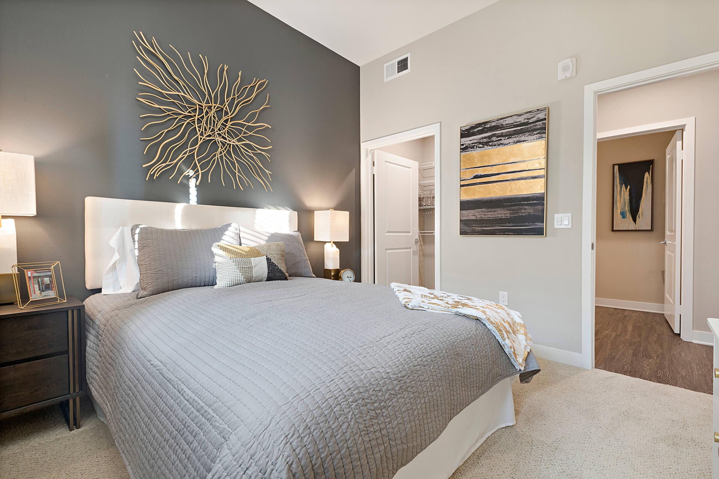 a bedroom with a large bed in a hotel room