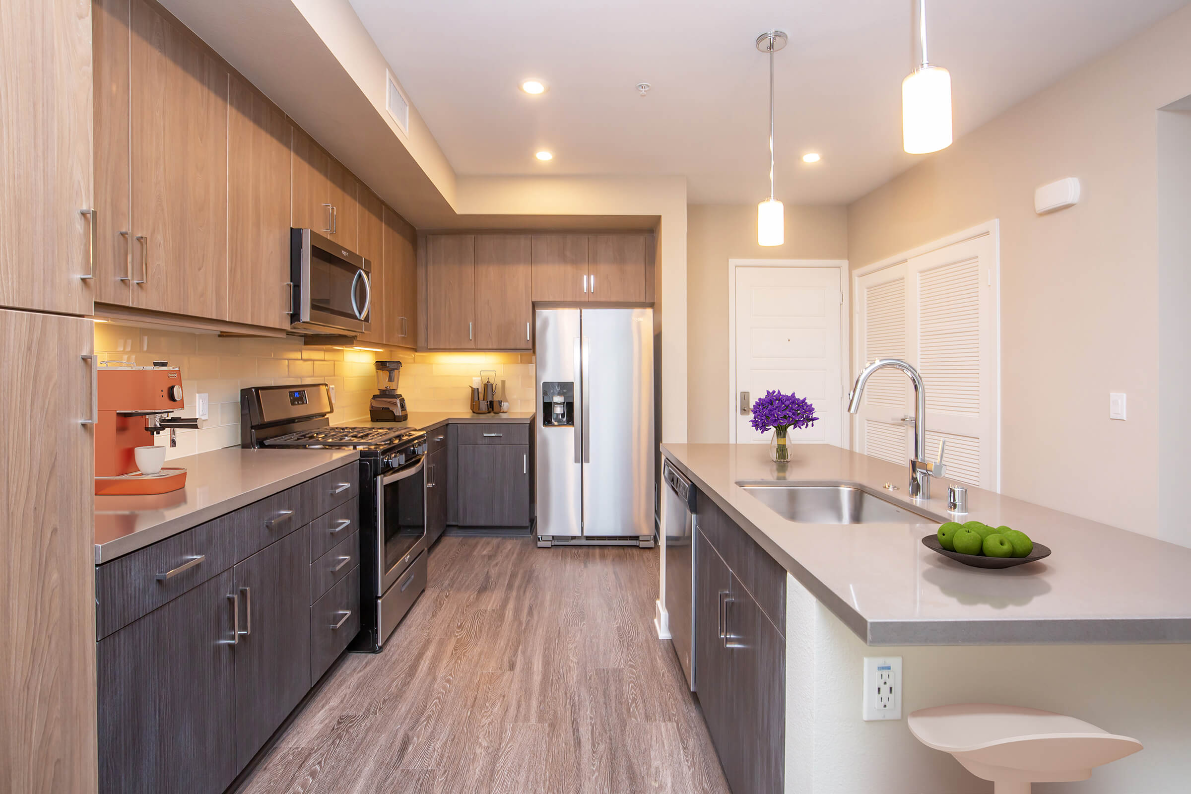 Kitchen with stainless steel appliance and wooden cabinets