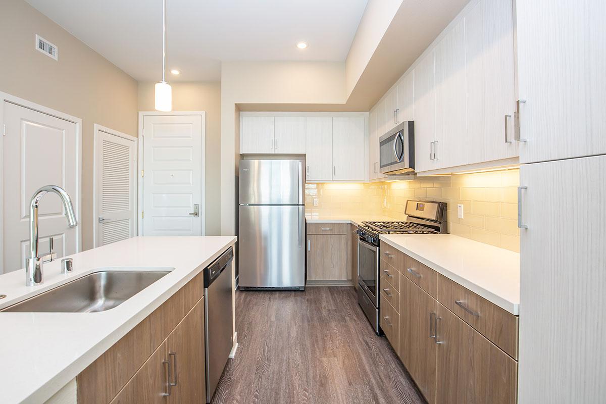 Kitchen with stainless steel appliances and white cabinets