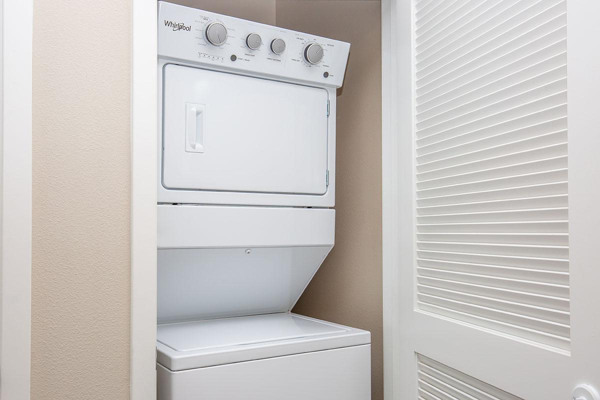 Stacked washer and dryer in laundry closet
