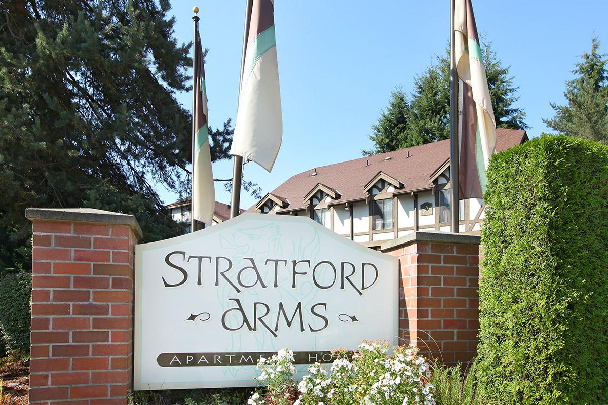 a sign in front of a brick building