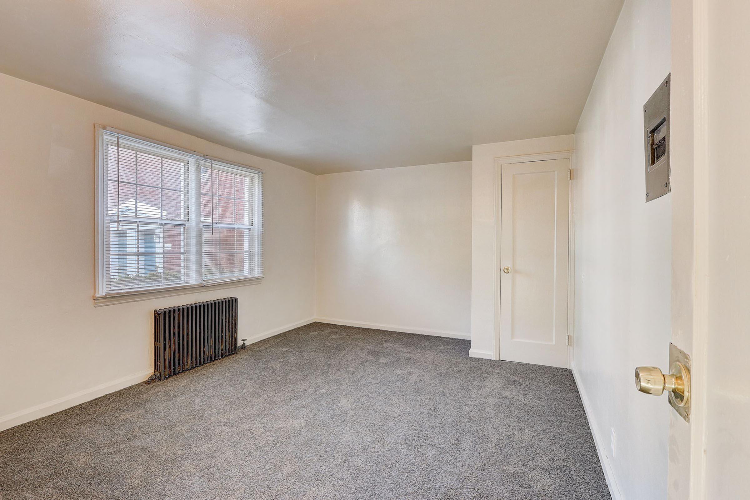 a bedroom with a large window