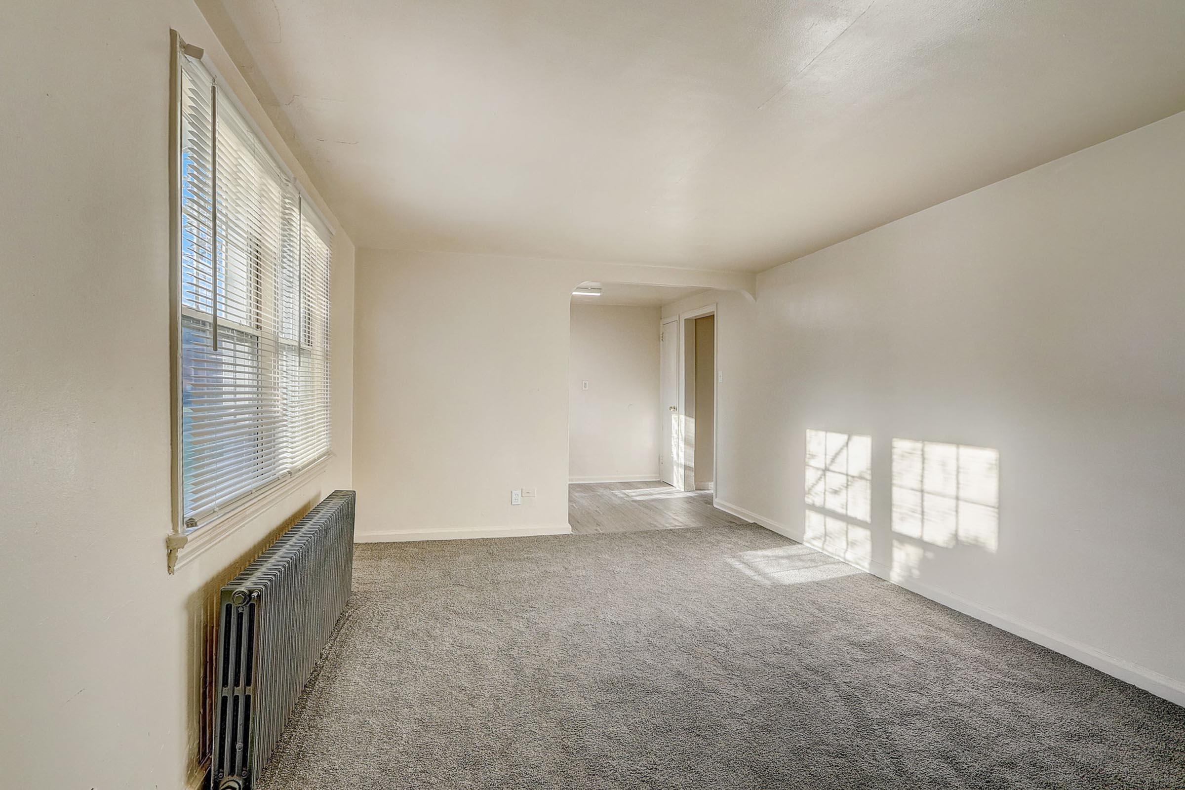 a bedroom with a large window