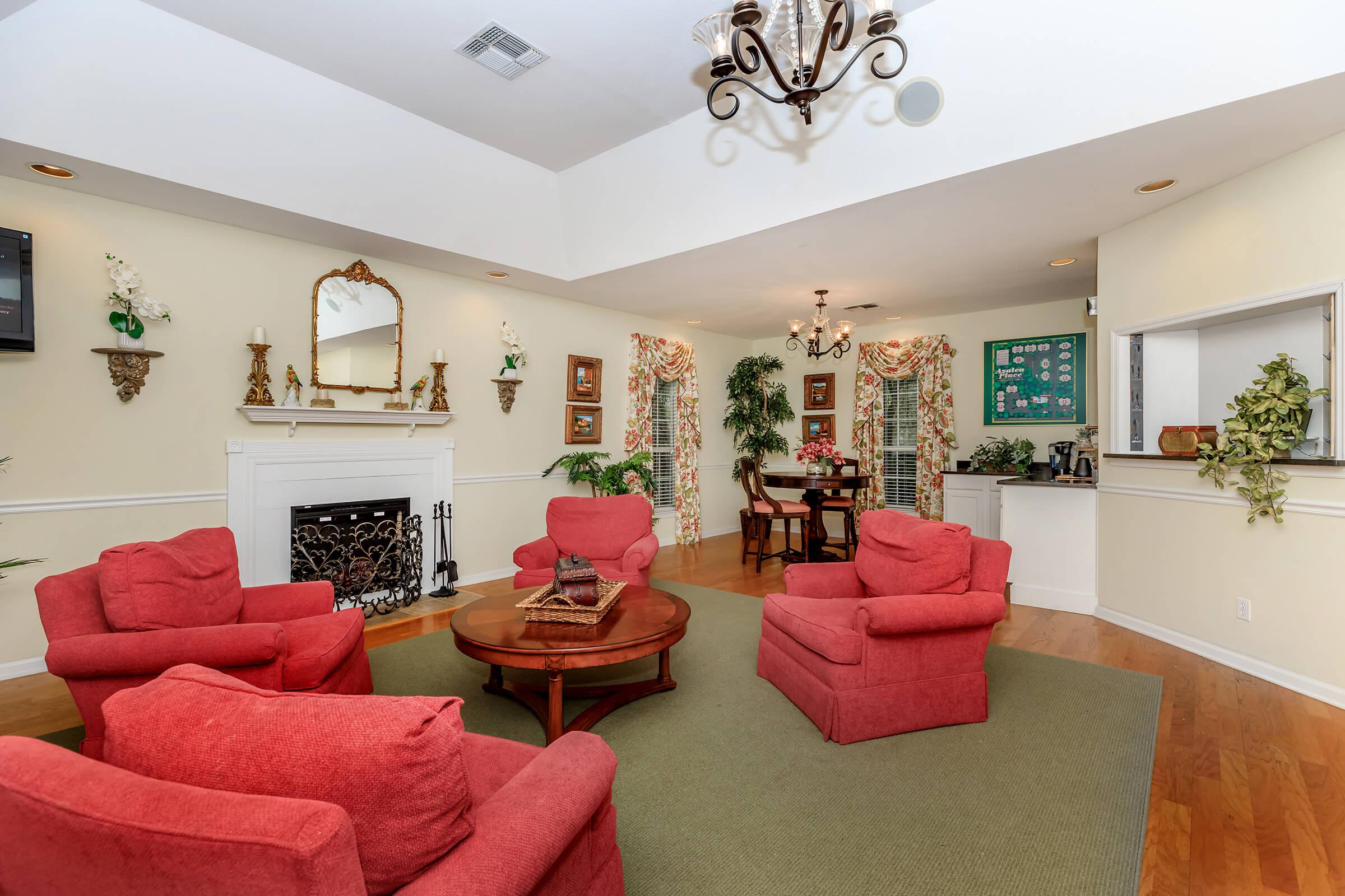 a living room filled with furniture and a flat screen tv