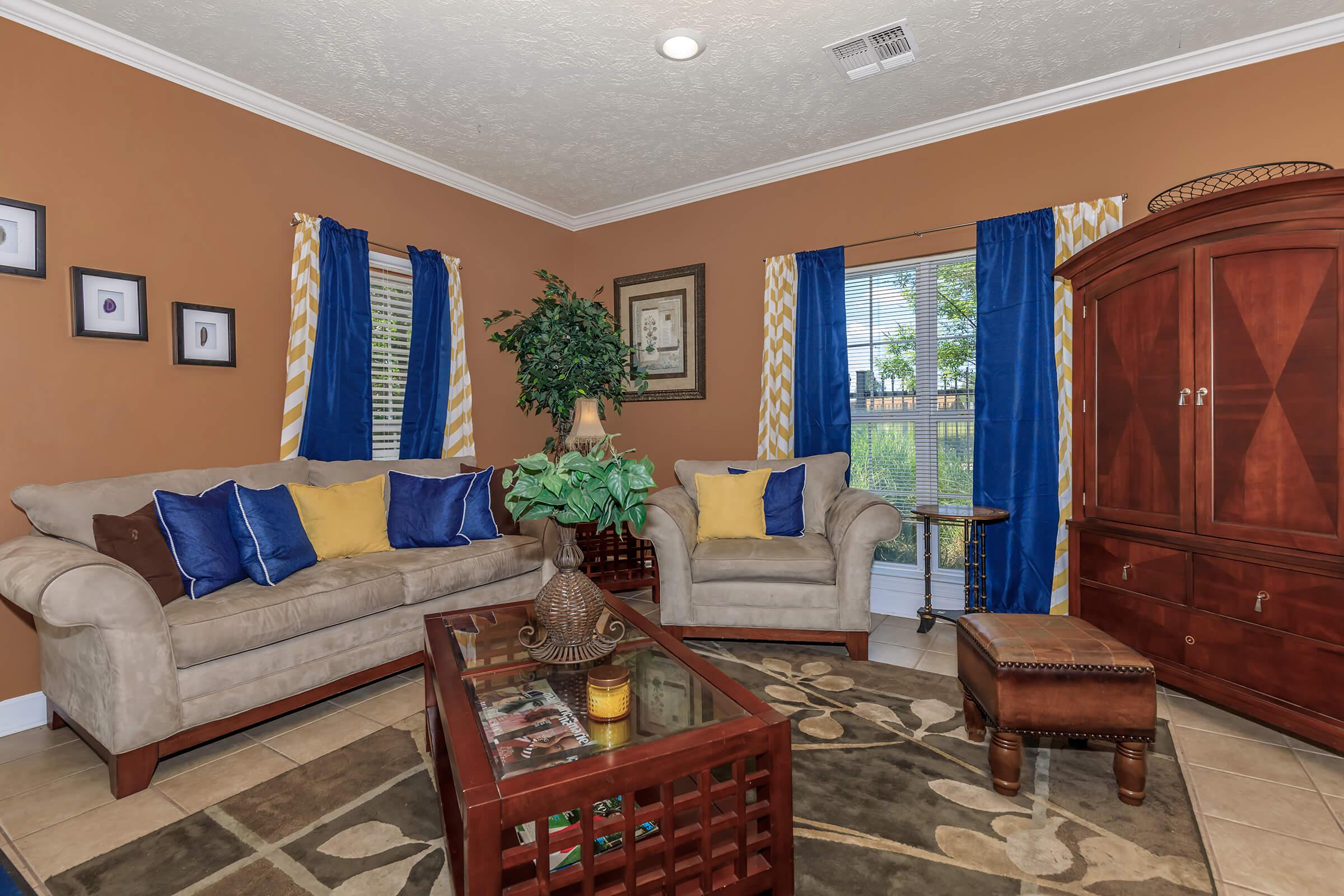 a living room filled with furniture and a fireplace