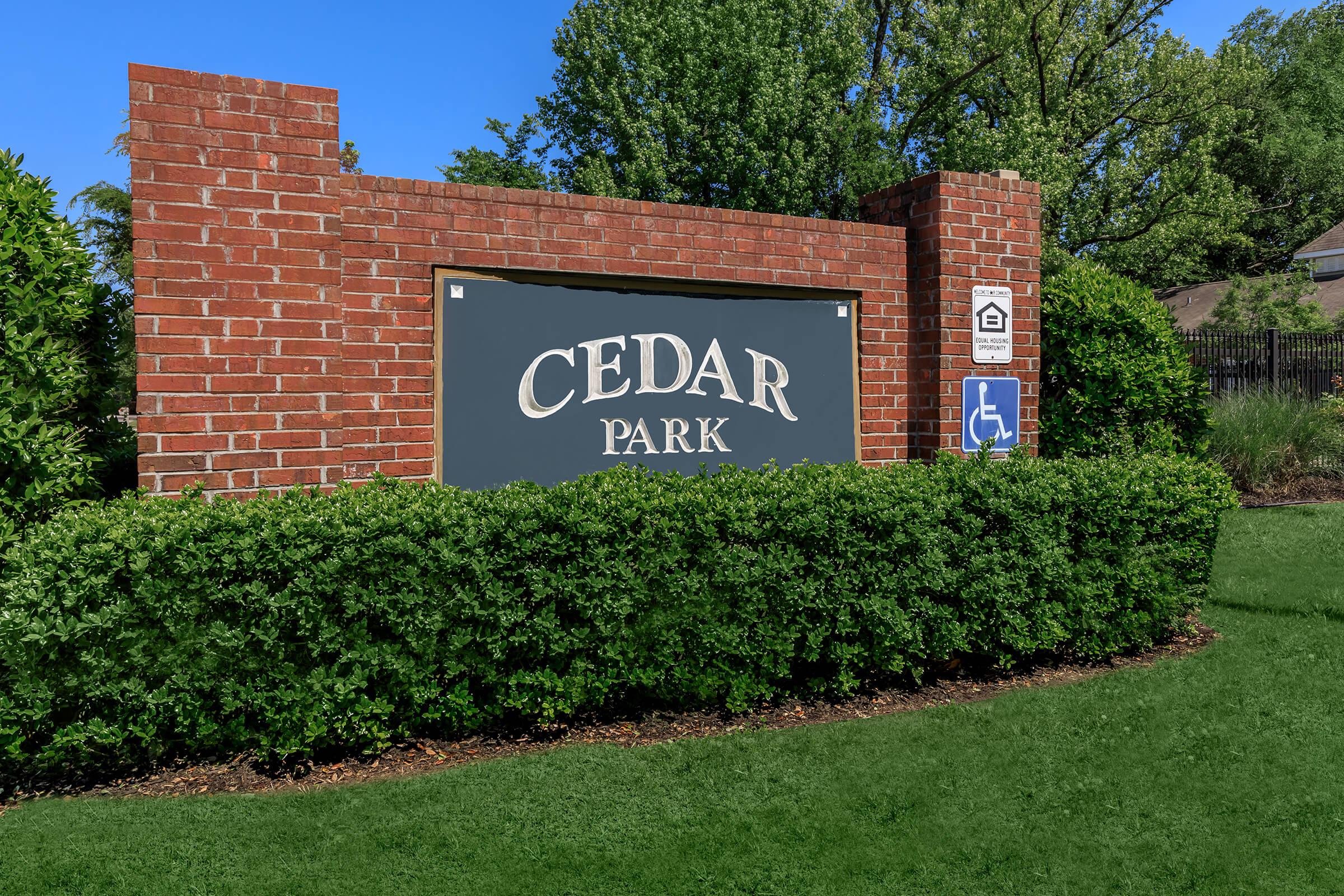 a sign in front of a brick building