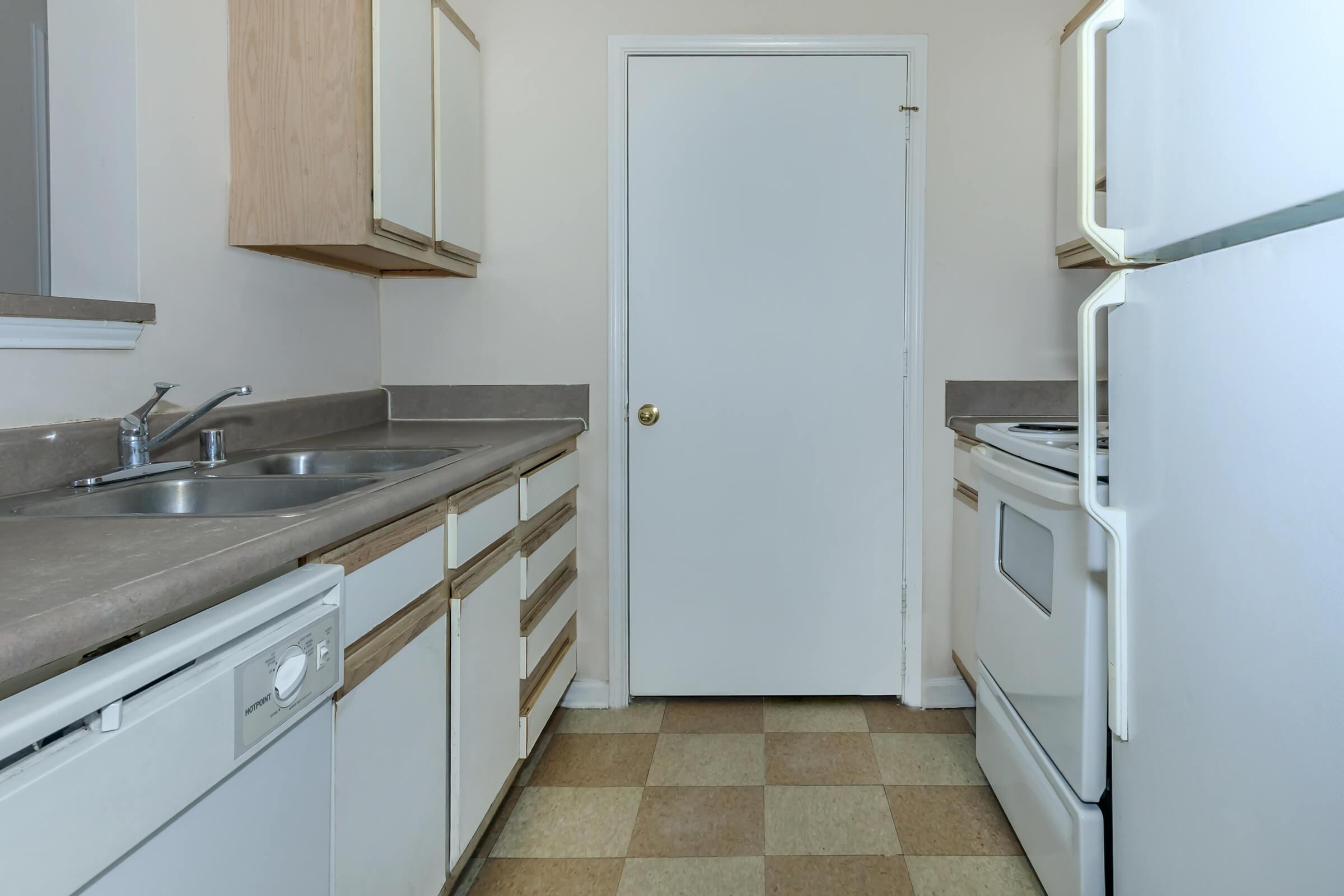 a white refrigerator freezer sitting inside of a kitchen