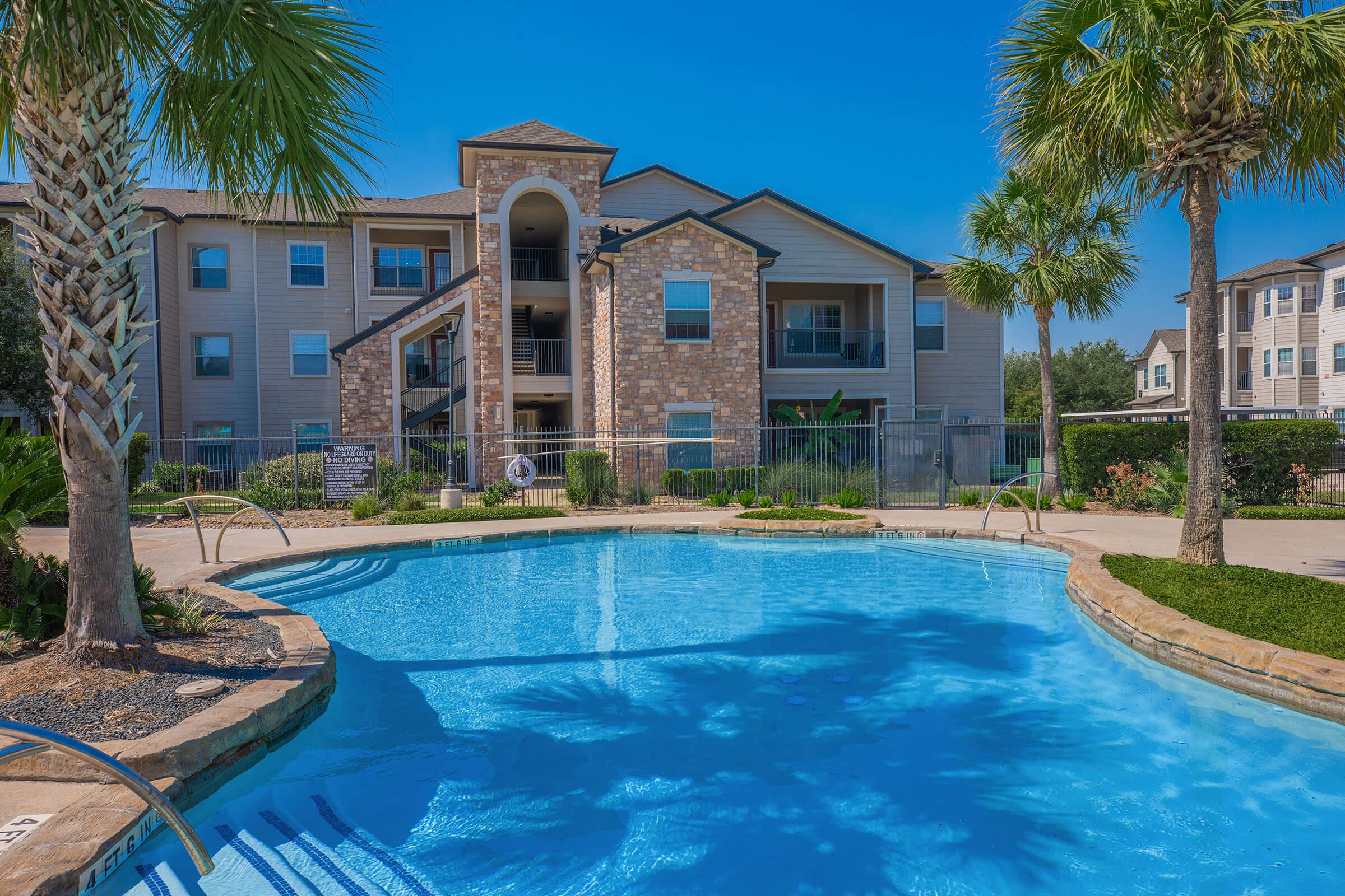 a large pool of water in front of a house