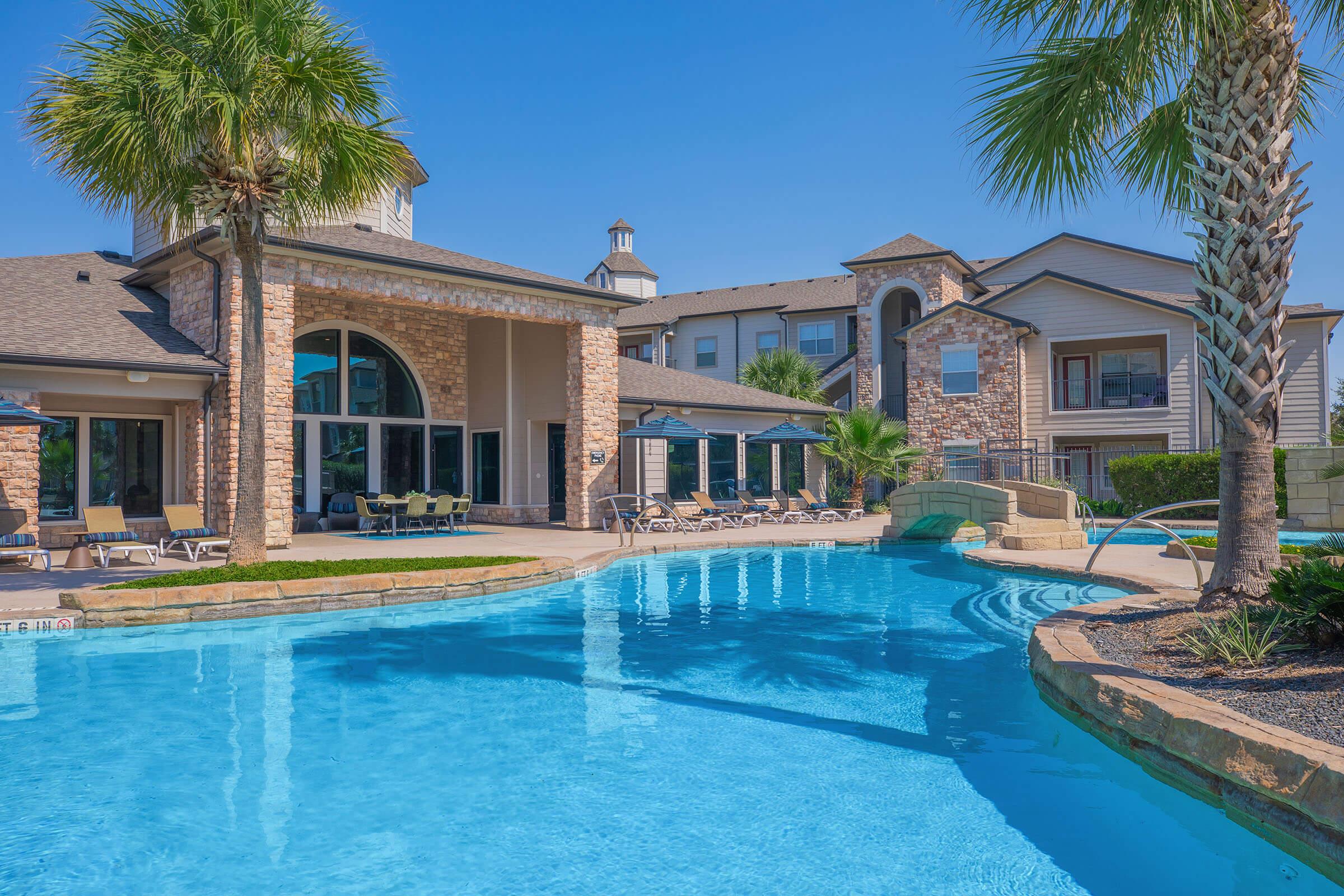 a large pool of water in front of a house