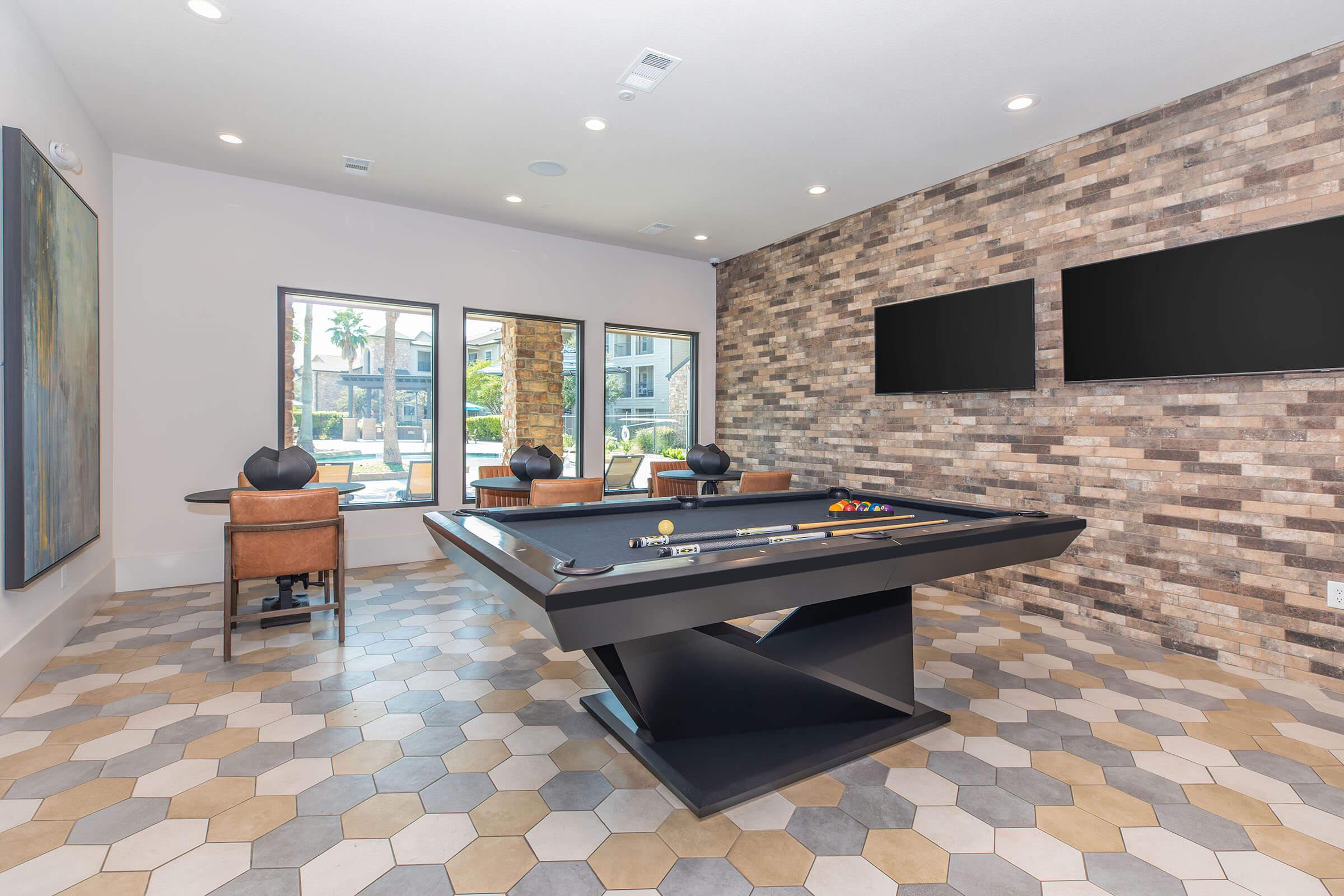 a living room filled with furniture and a large window