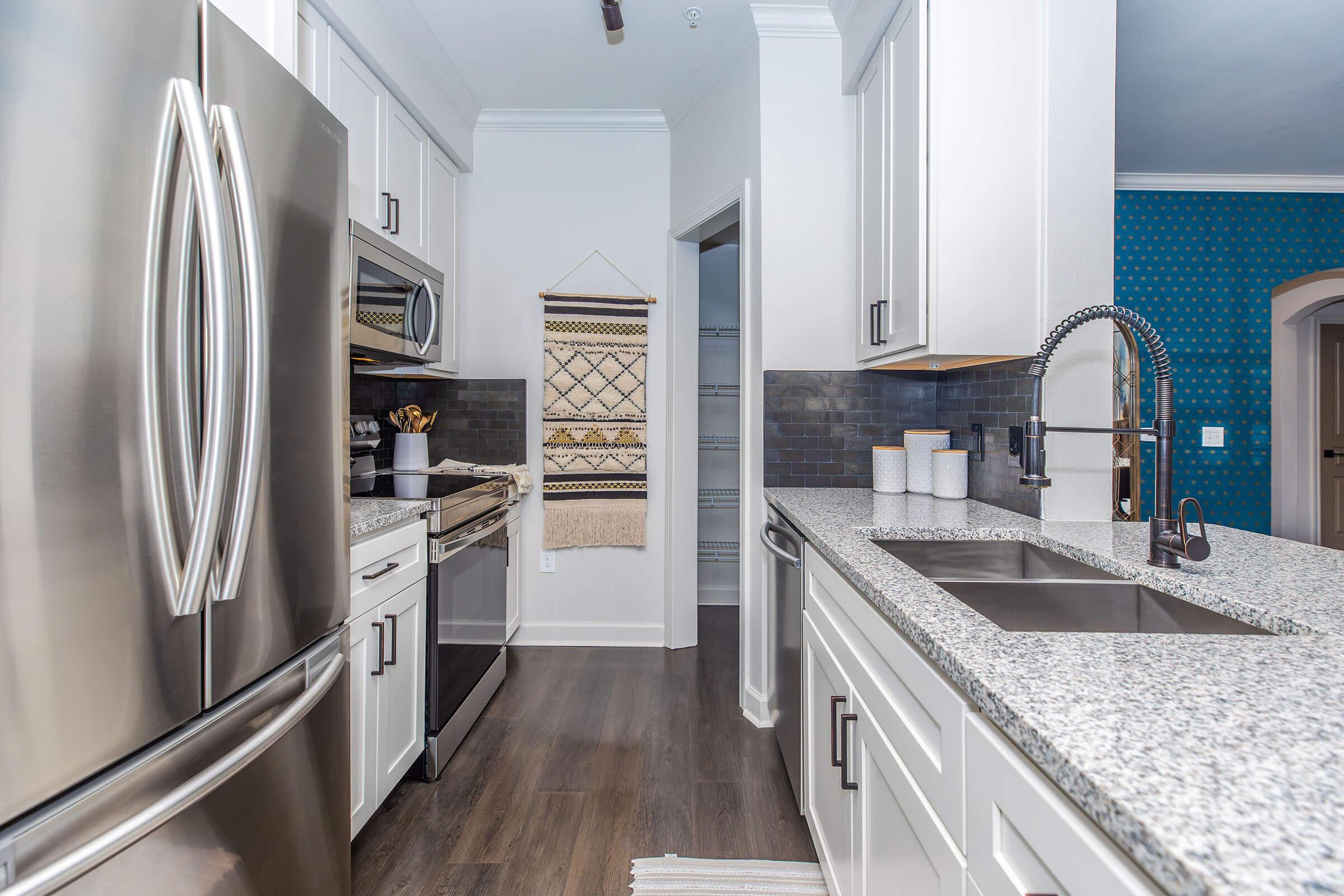 a stainless steel refrigerator in a kitchen