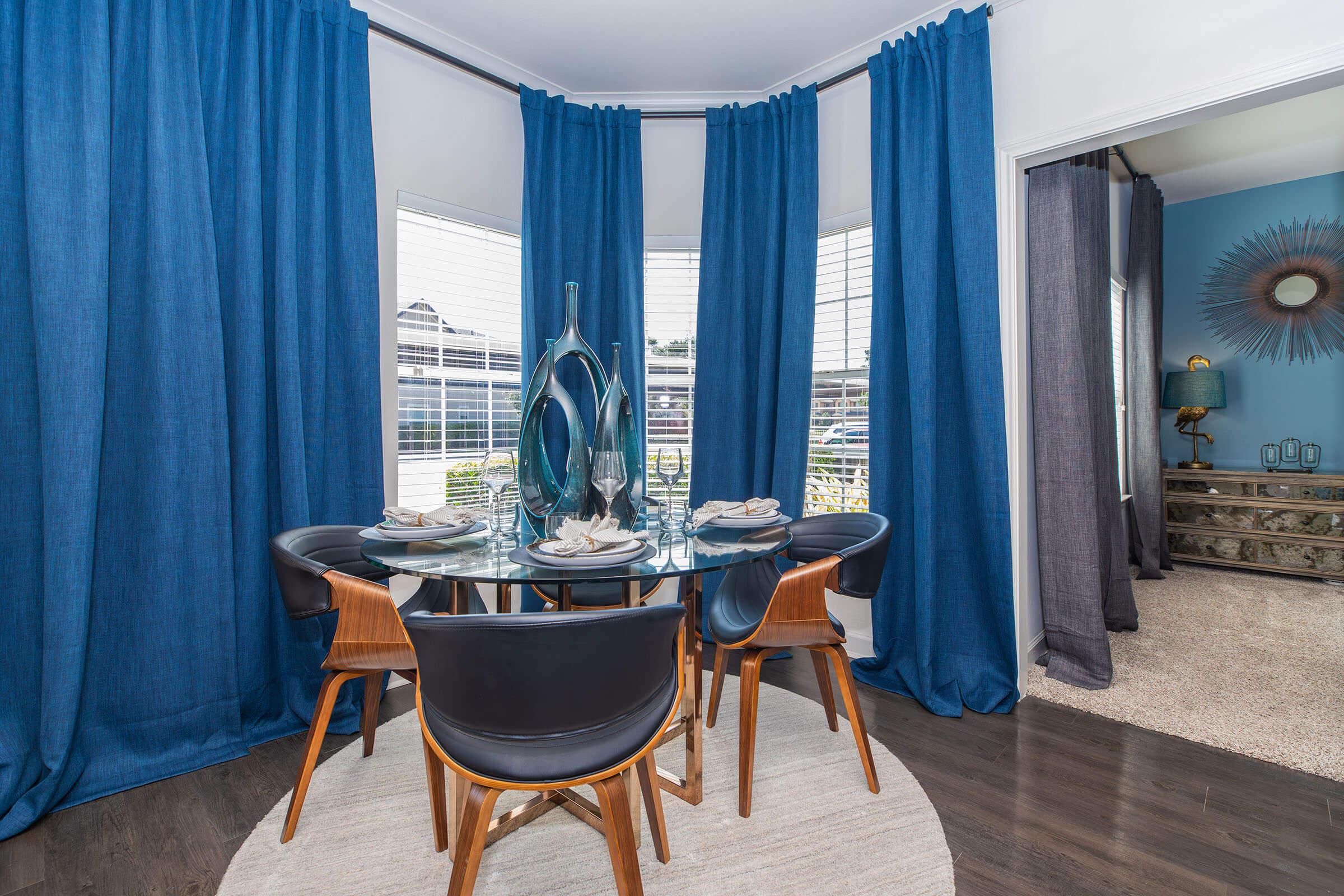 a room filled with furniture and a shower curtain