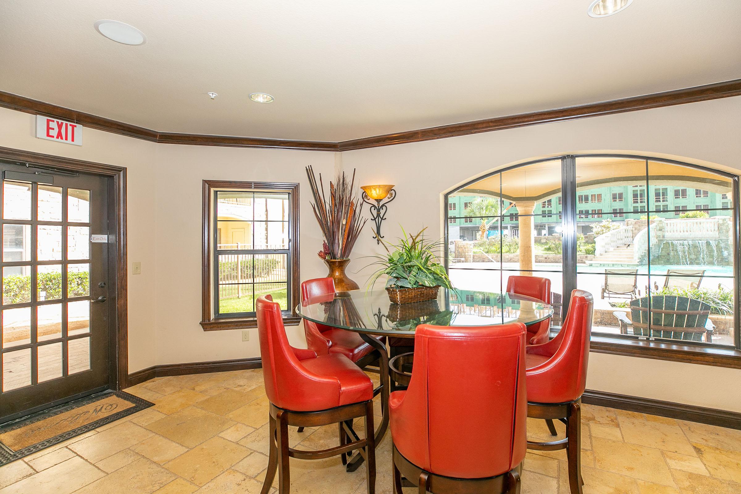 a living room filled with furniture and a large window