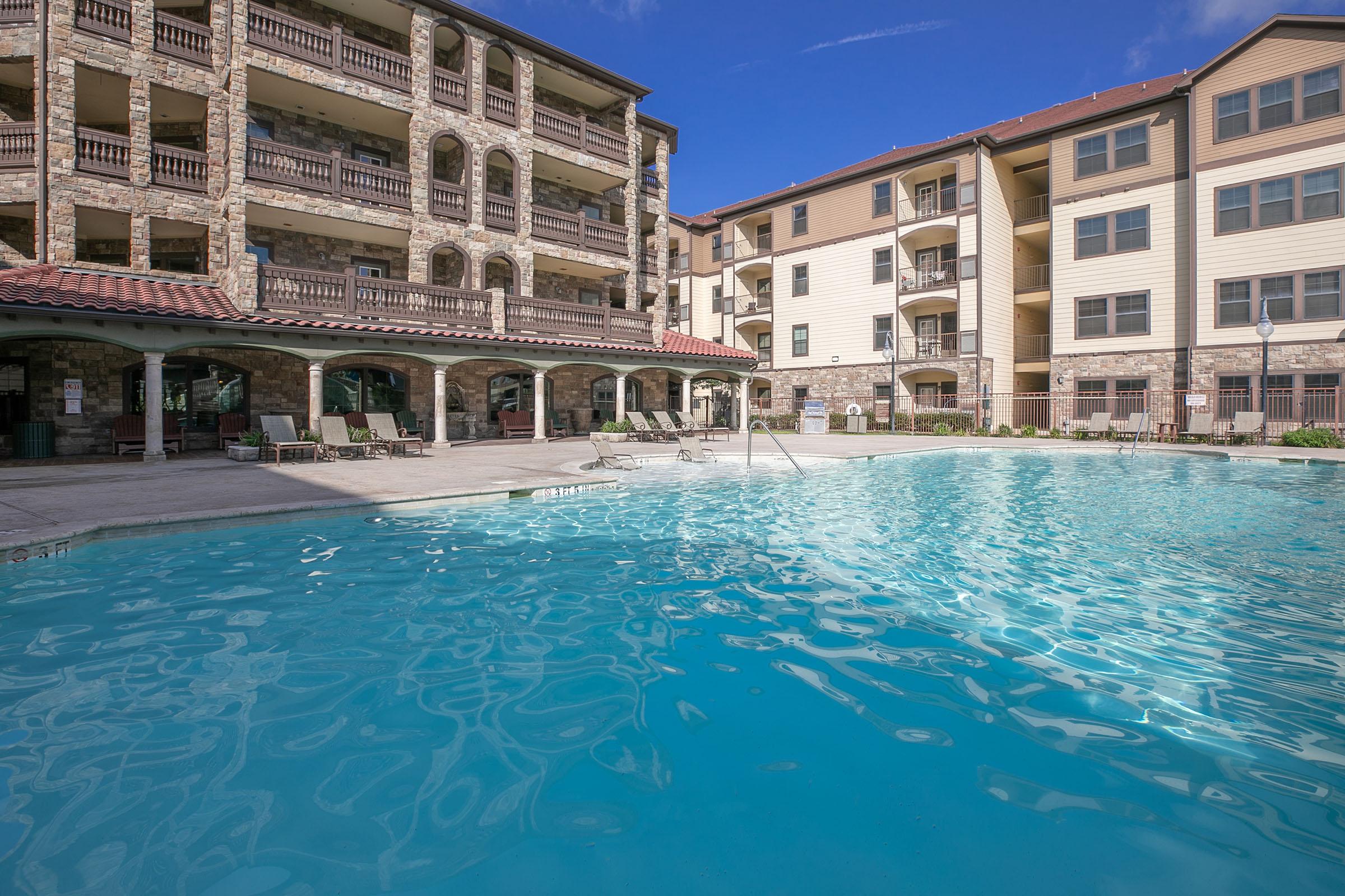 a large pool of water in front of a building