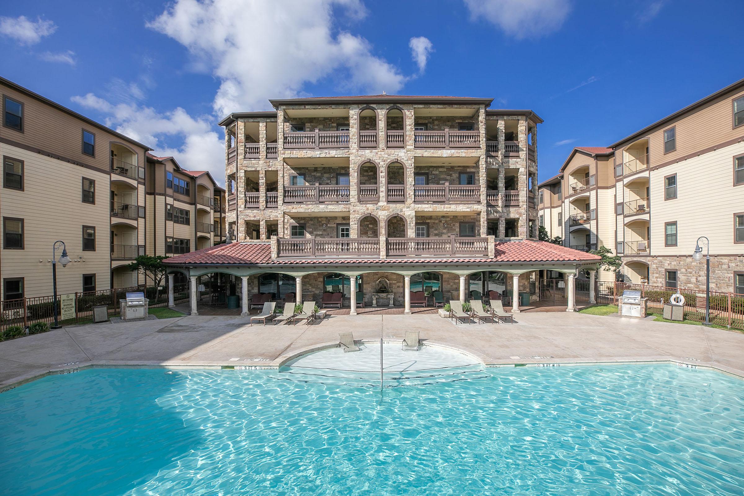 a large pool of water in front of a building