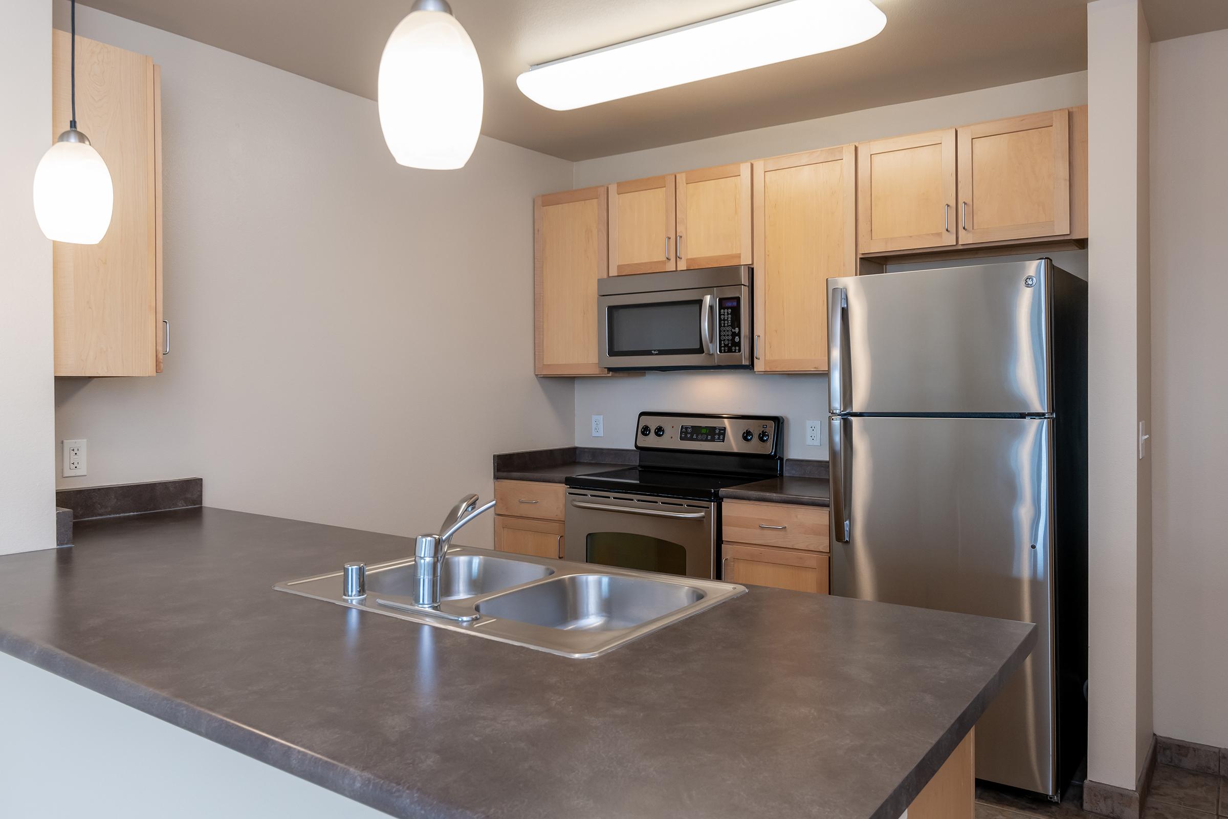 a modern kitchen with stainless steel appliances