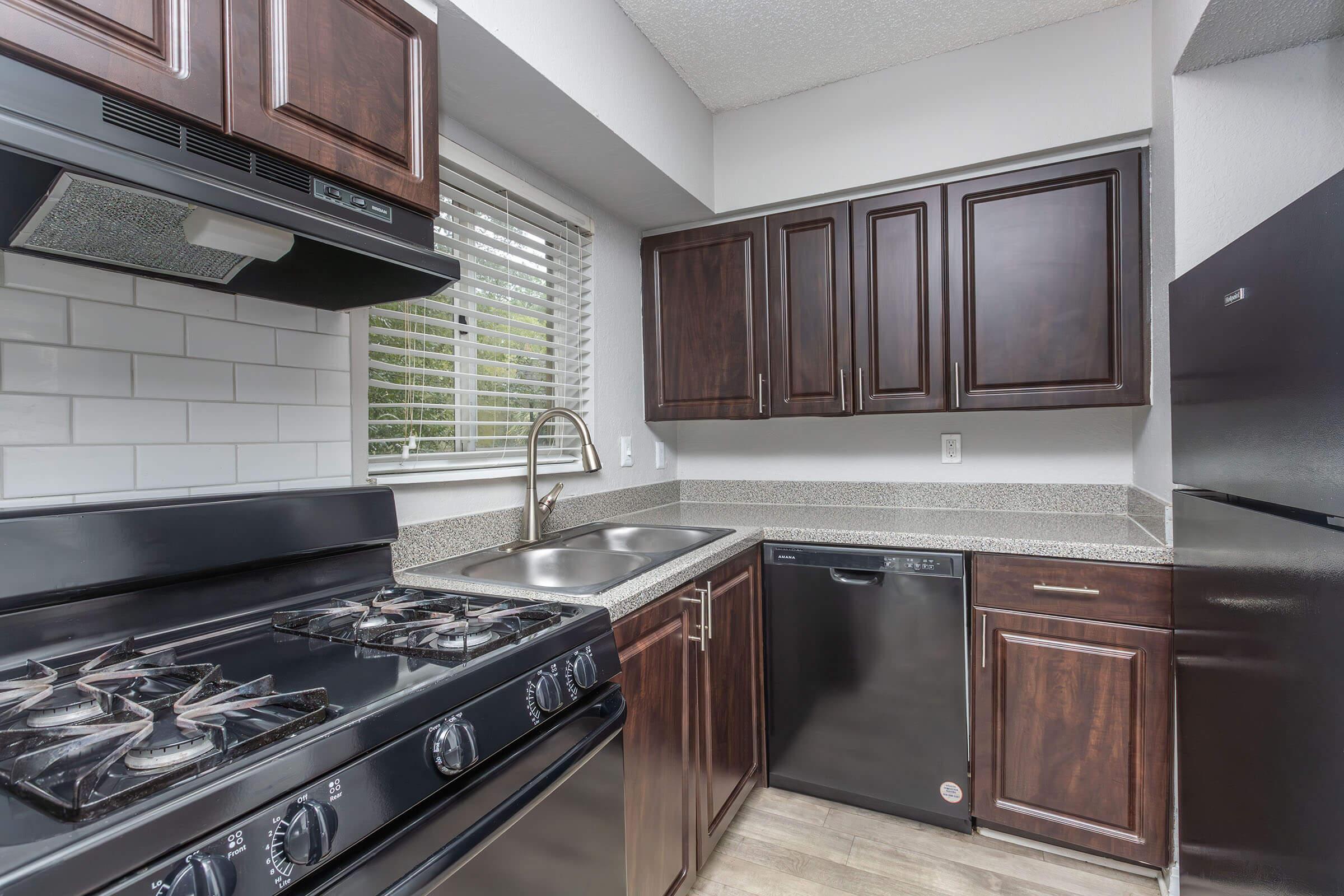 a kitchen with a stove top oven