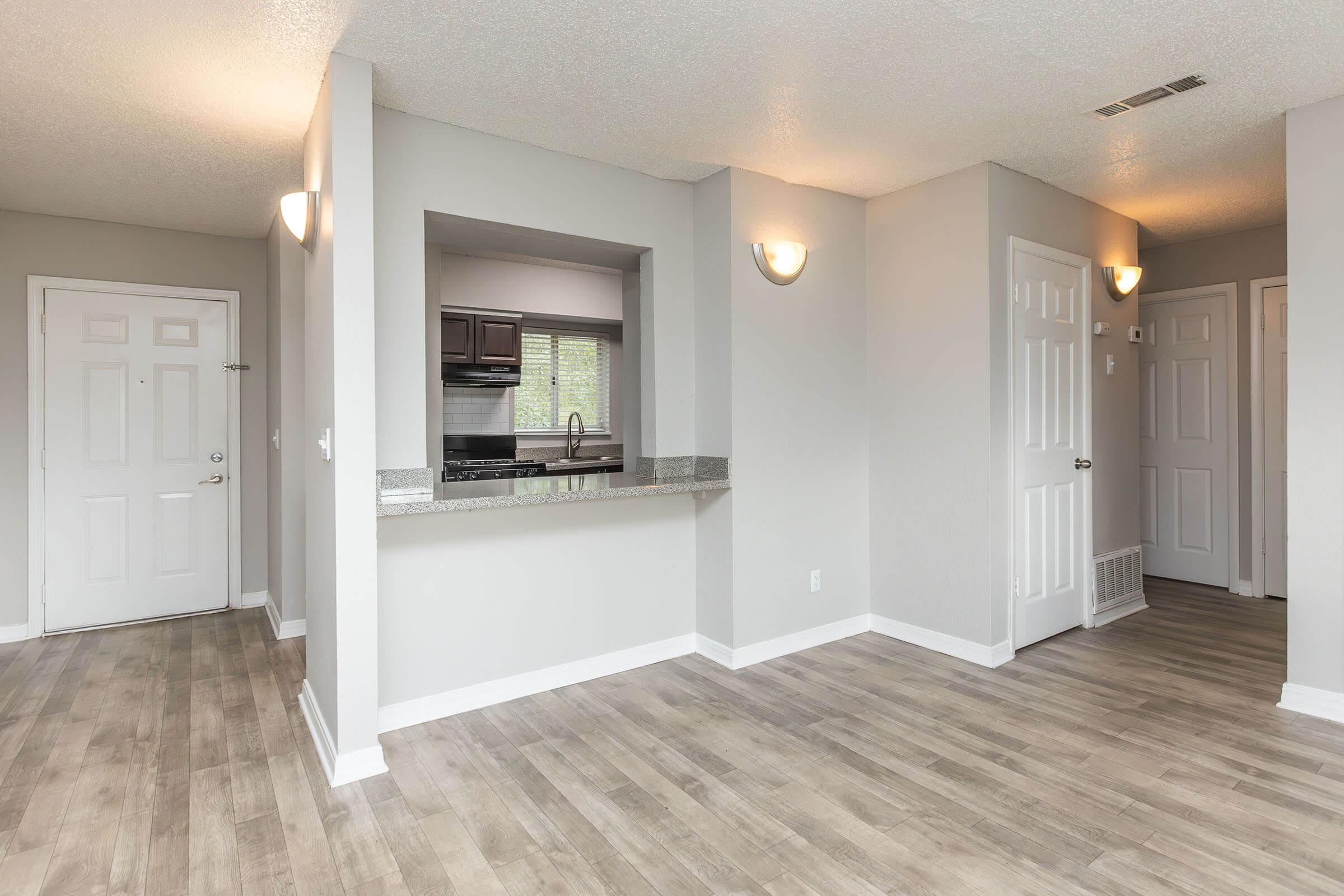 a room filled with furniture and a large window