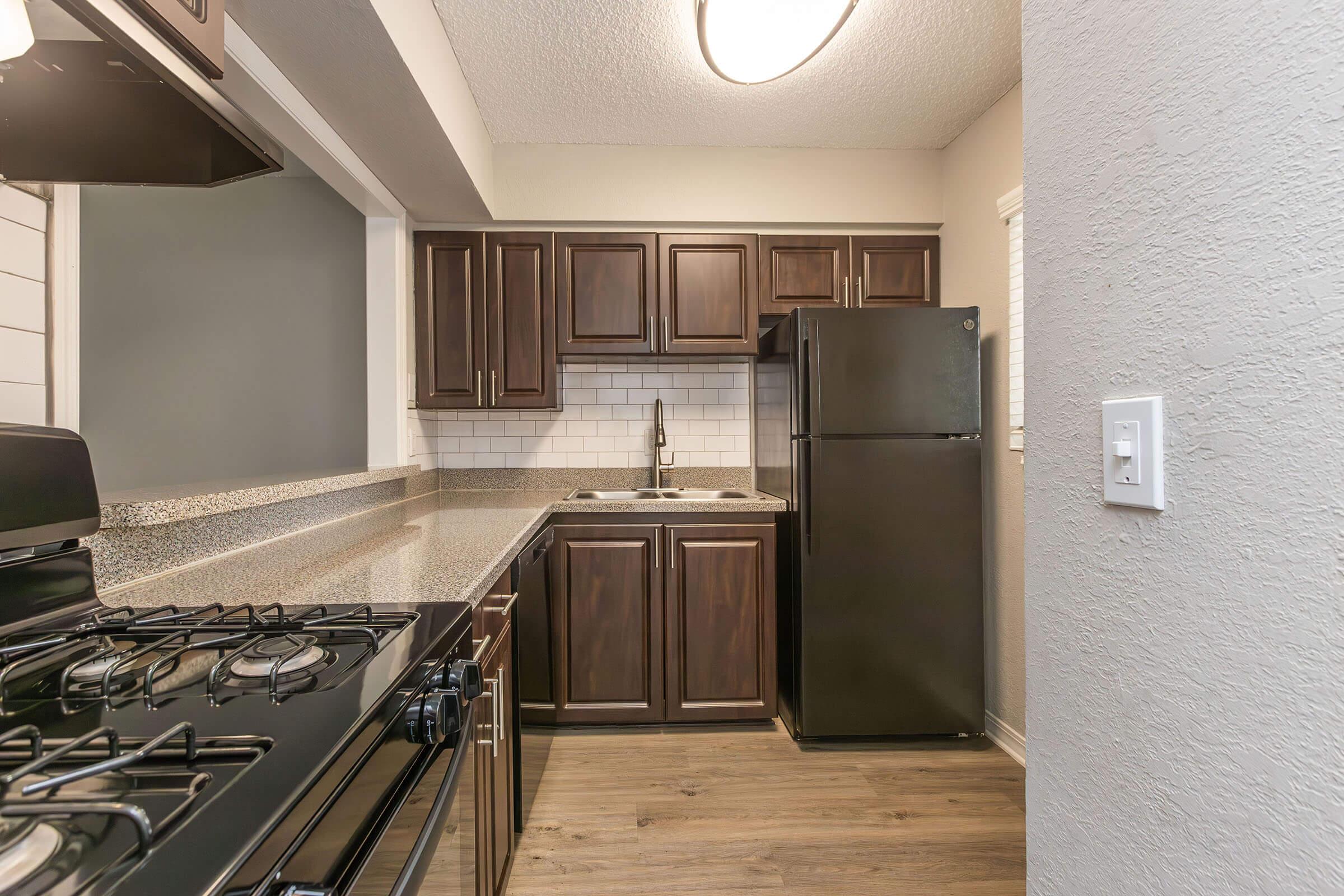 a large kitchen with stainless steel appliances