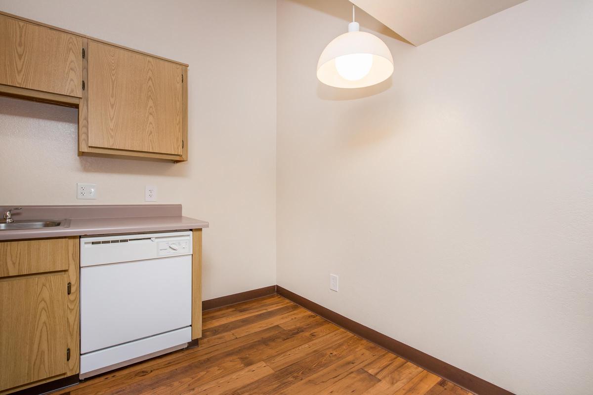 a kitchen with a wooden floor