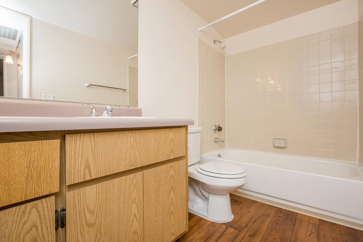 a large white tub sitting next to a sink