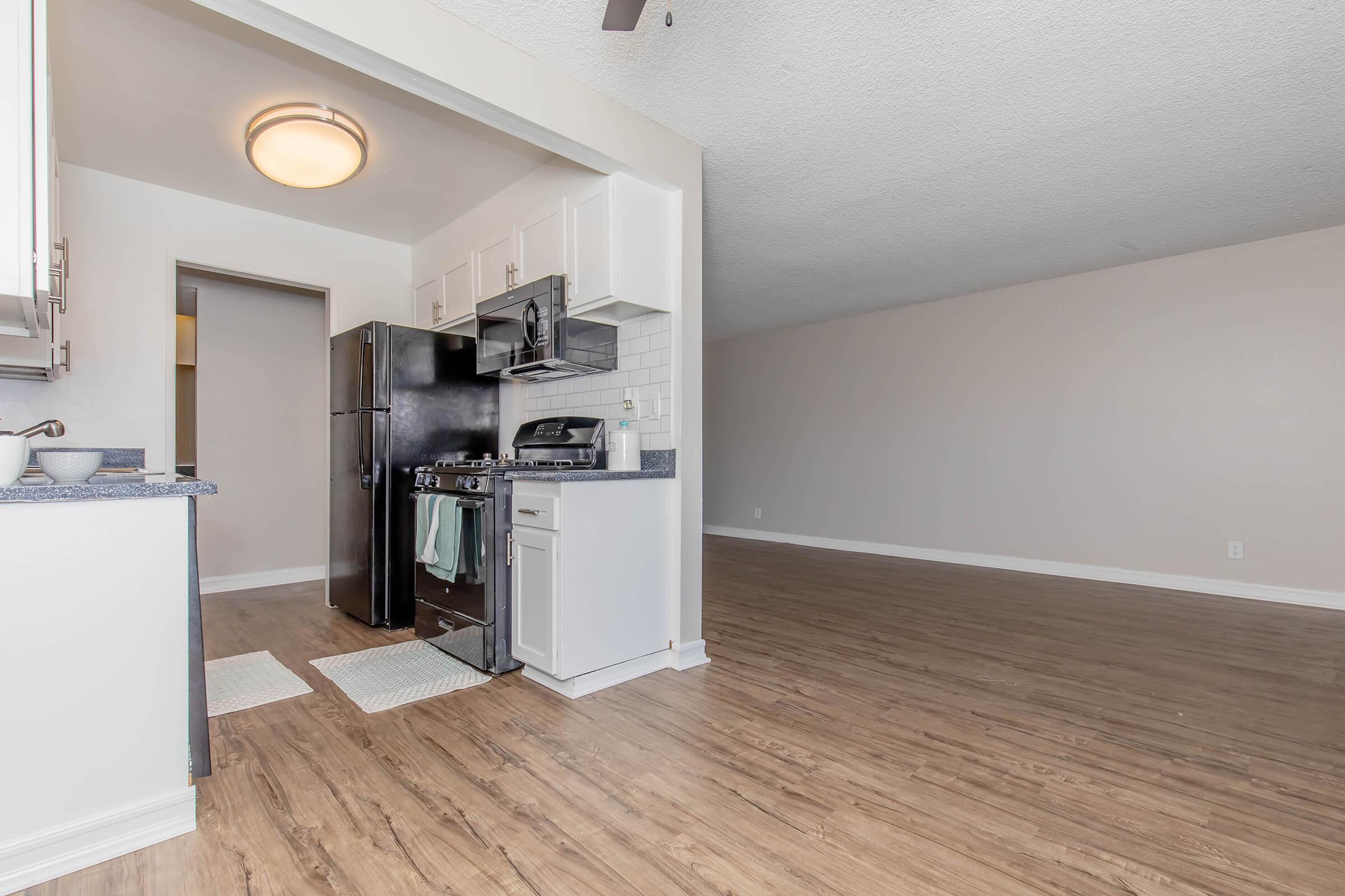 a kitchen with a wooden floor