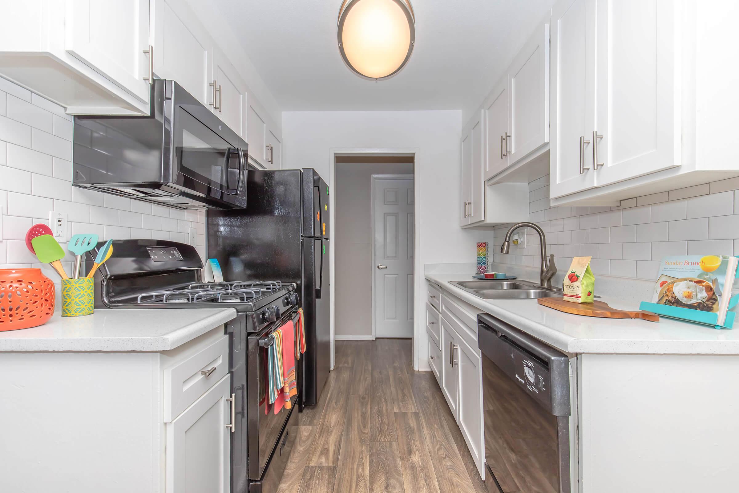 a kitchen with a stove and a refrigerator