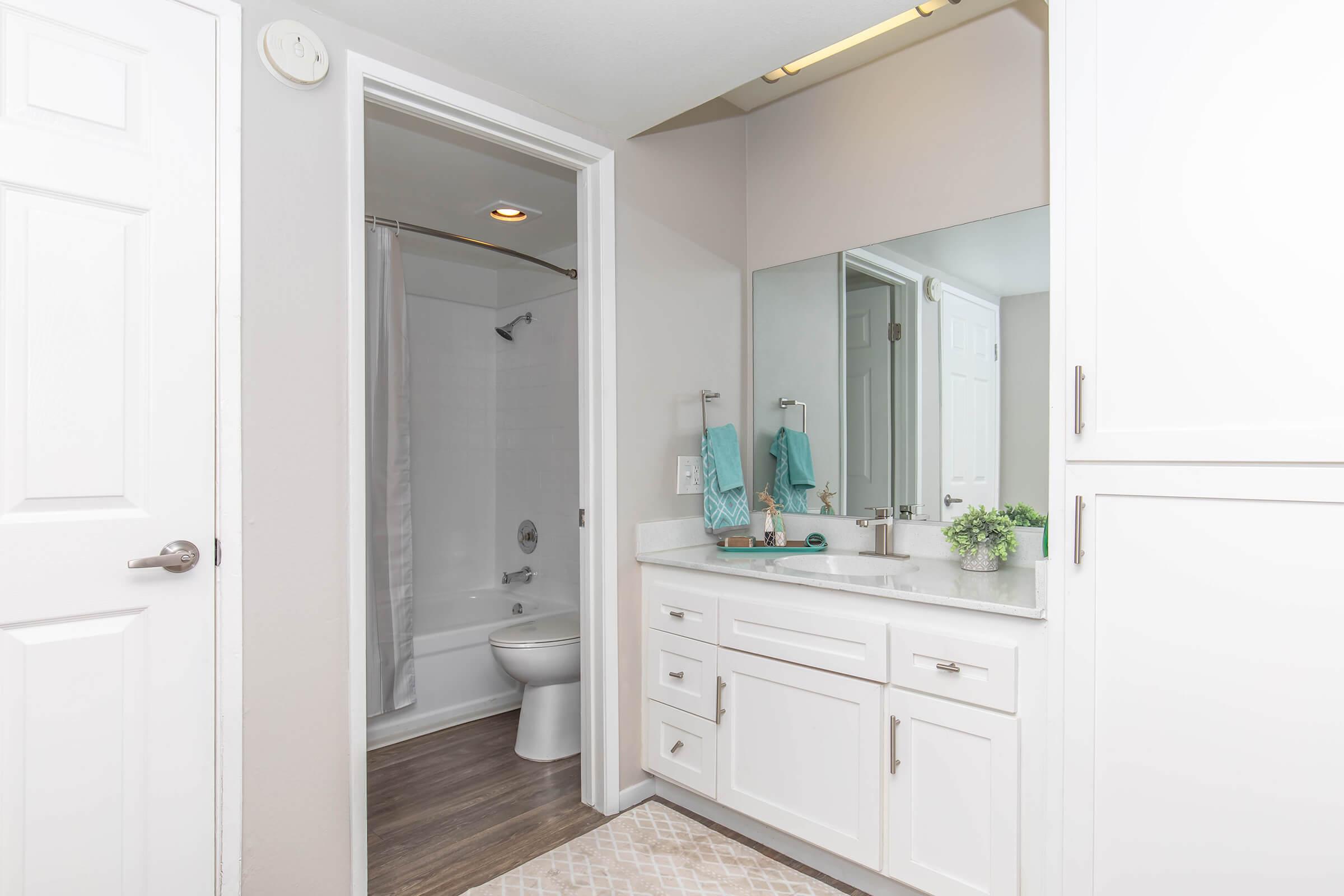 a kitchen with a sink and a mirror