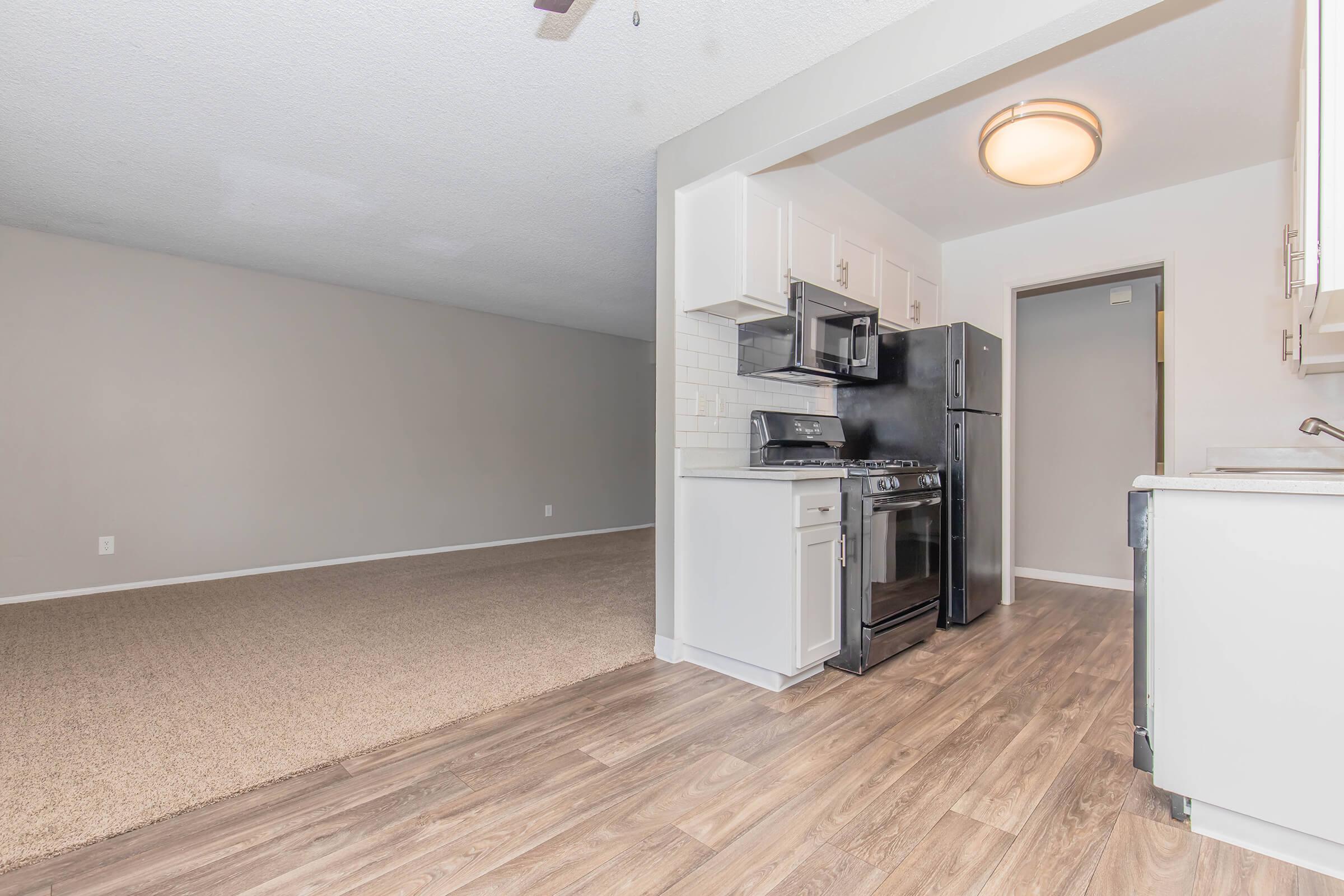 a kitchen with a sink and a refrigerator