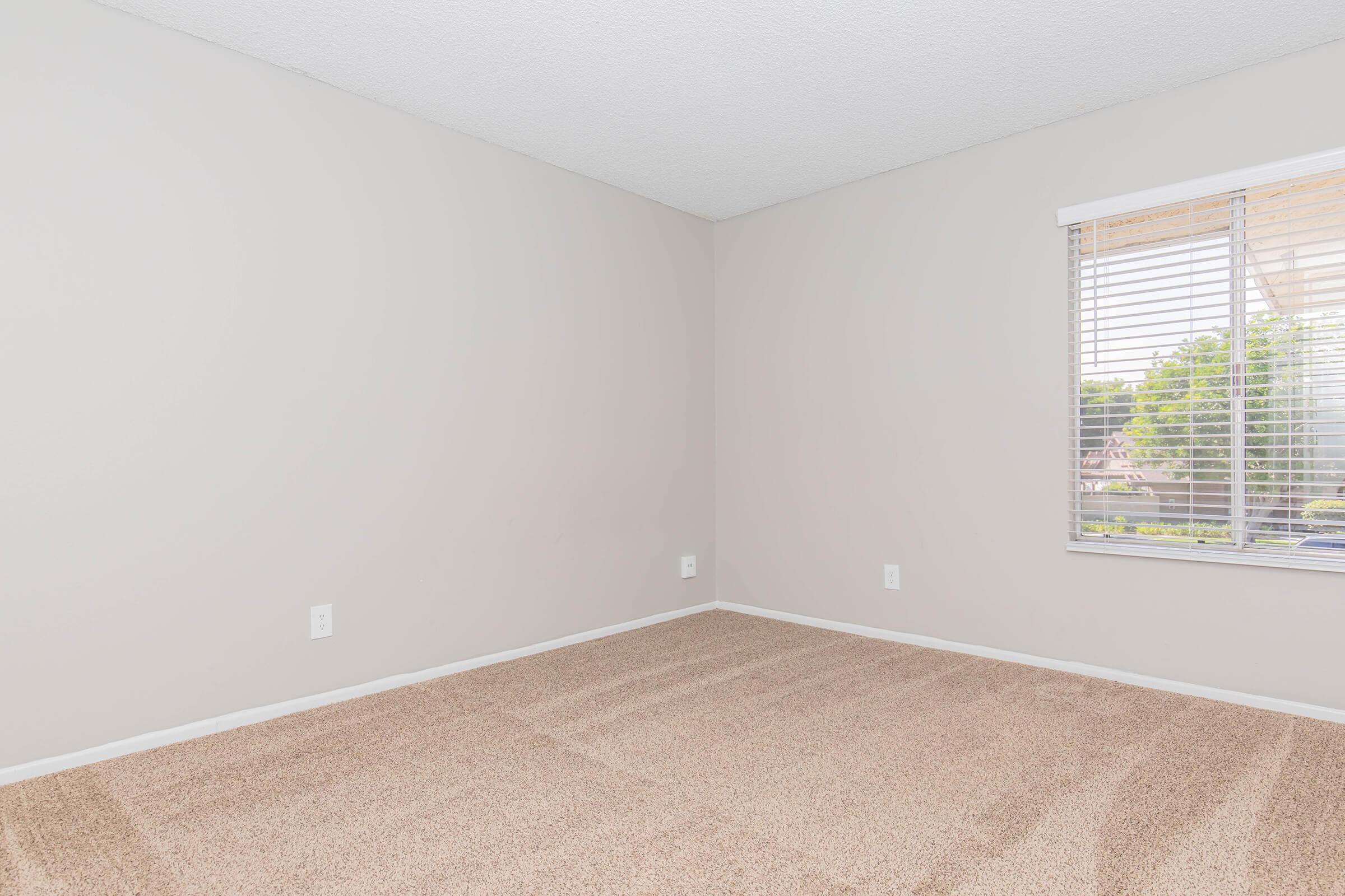 a bedroom with a large window