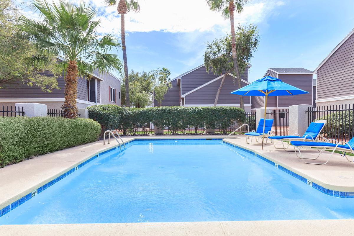 a house with a pool outside of a building