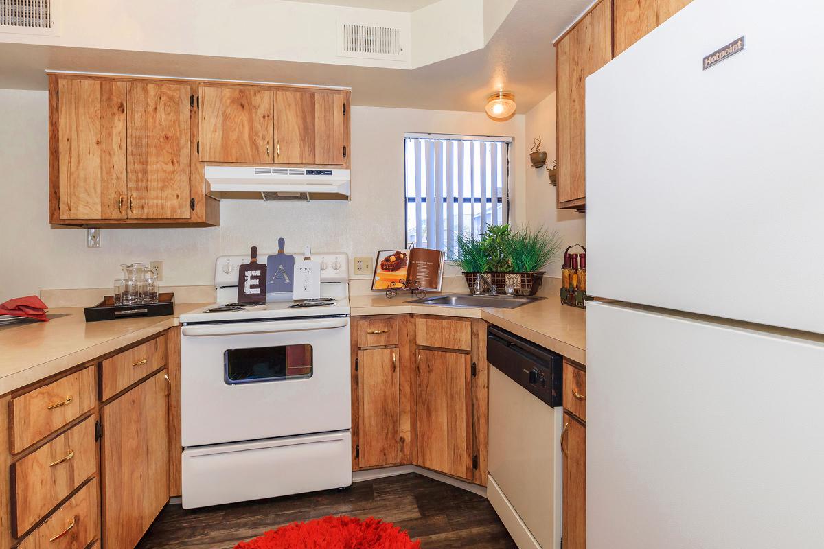 a kitchen with a stove top oven sitting inside of a refrigerator