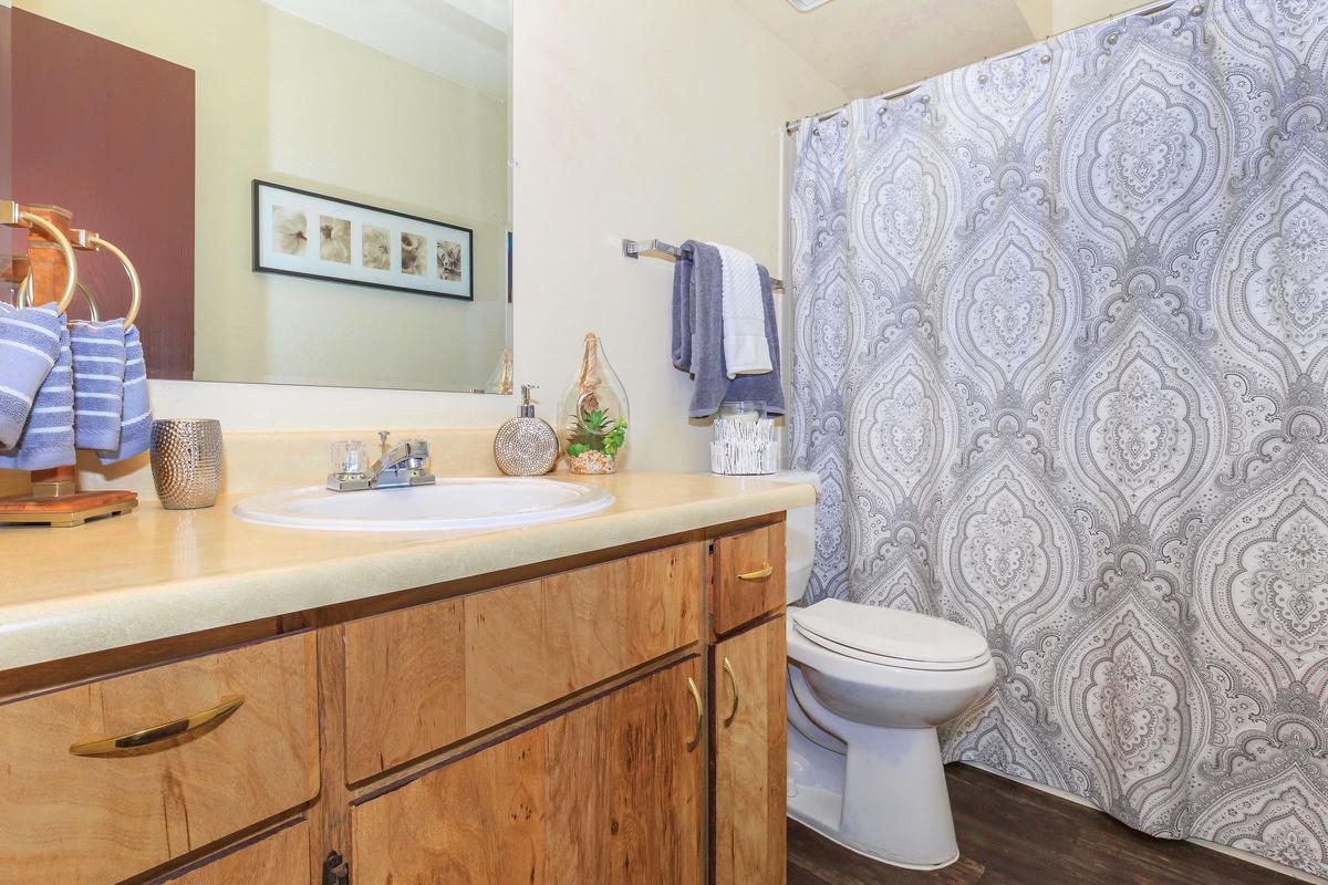 a kitchen with a sink and a mirror