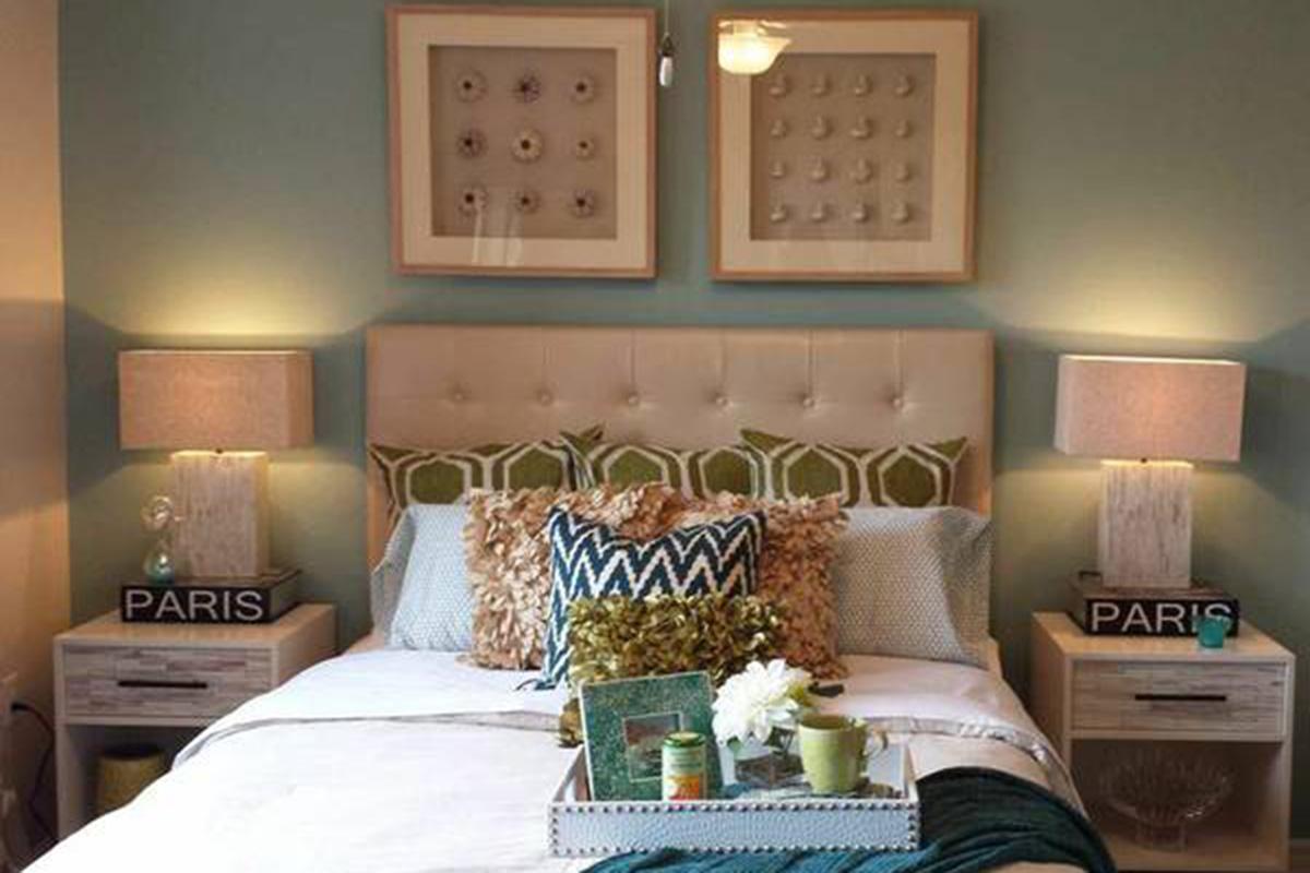 a bedroom with a bed in a room