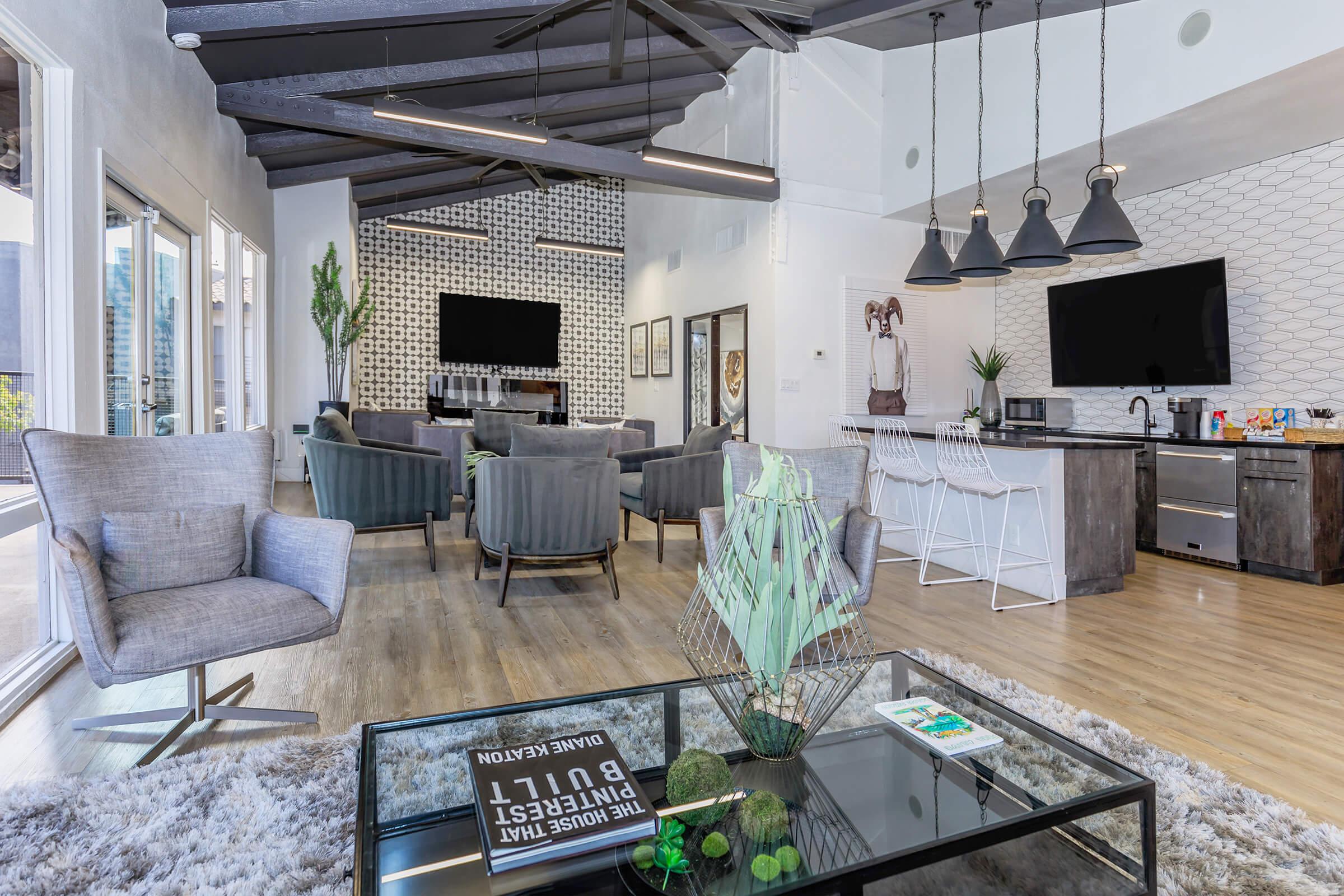 a living room filled with furniture and a fireplace