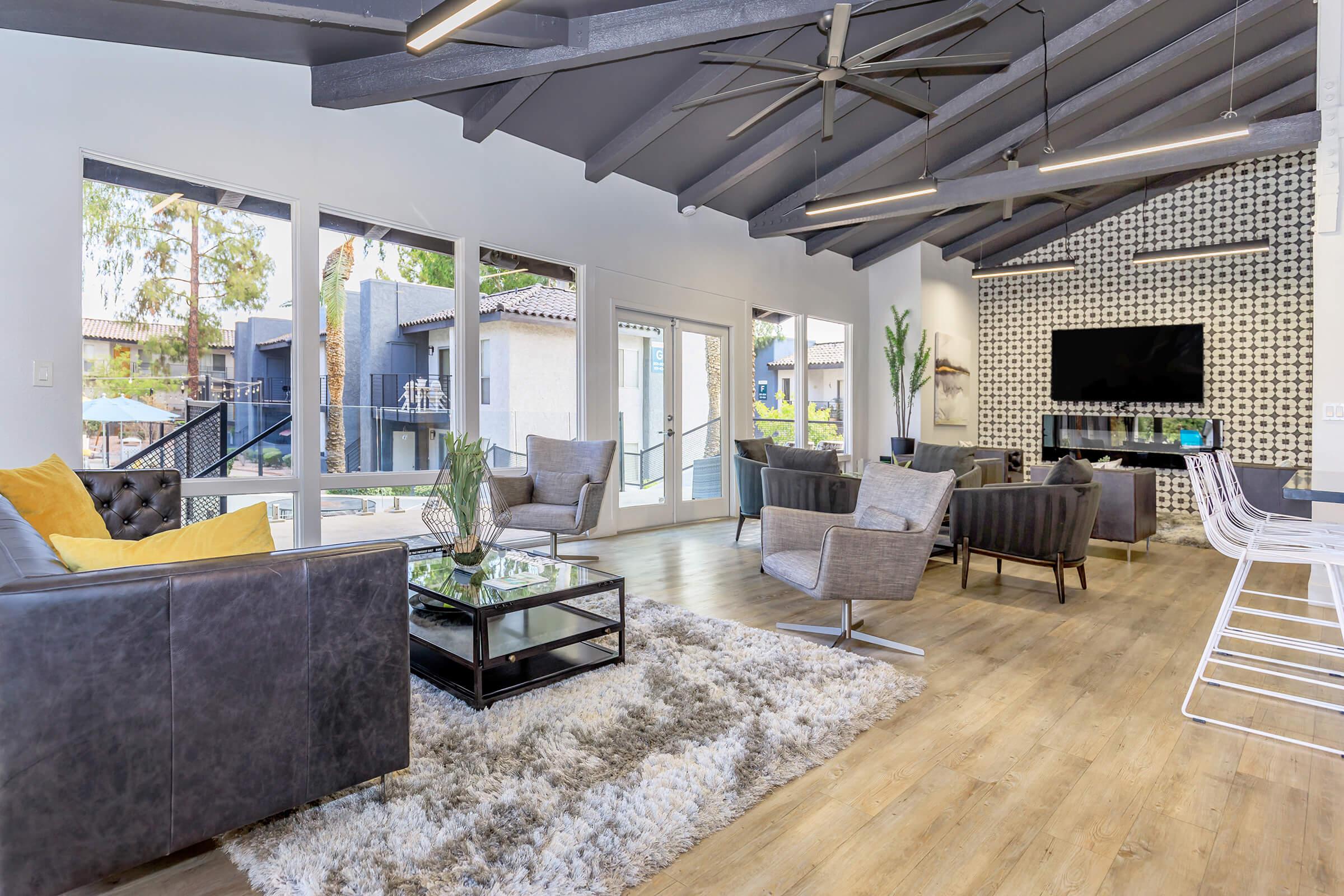 a living room filled with furniture and a fireplace