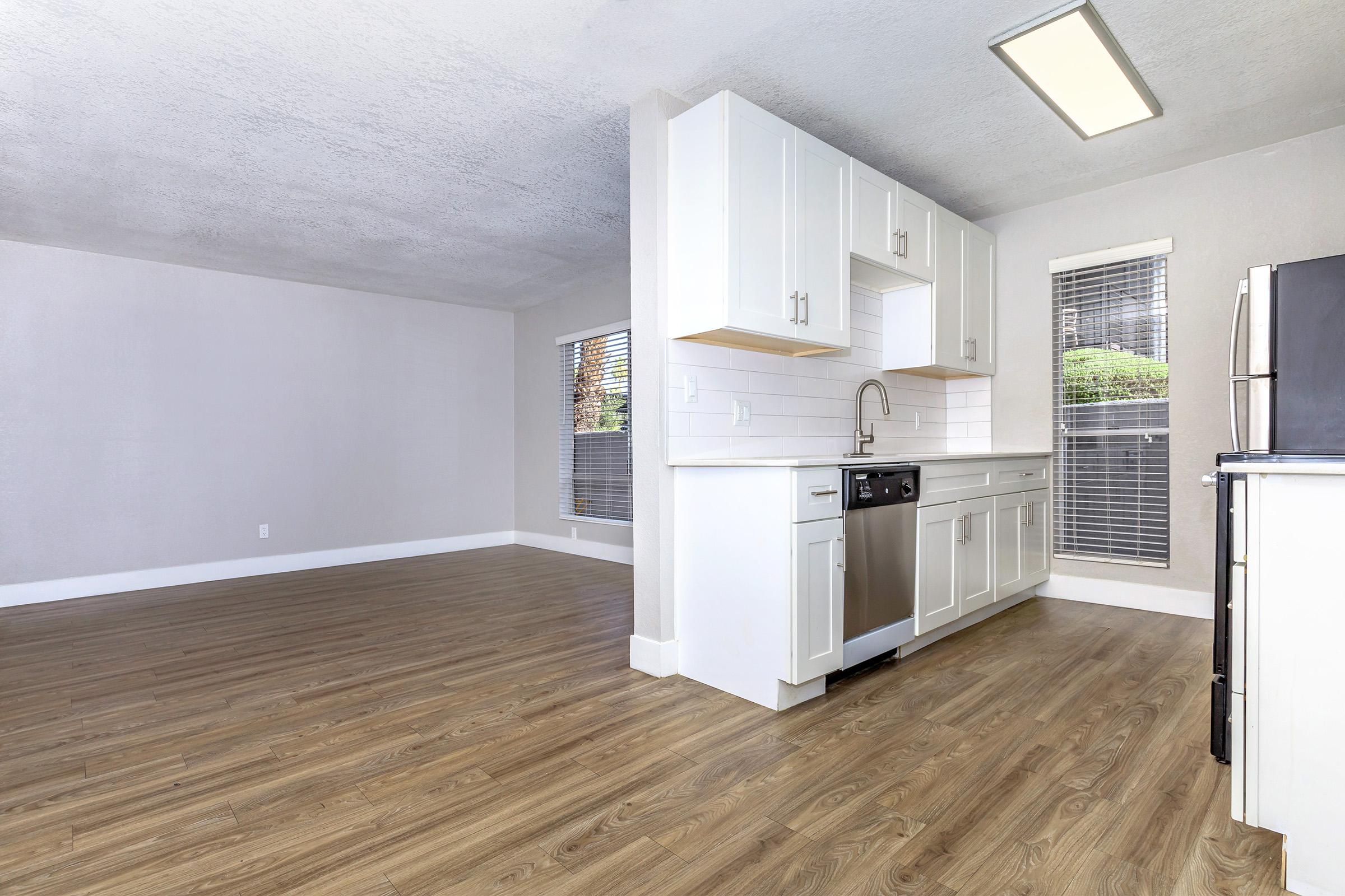 a kitchen with a wood floor