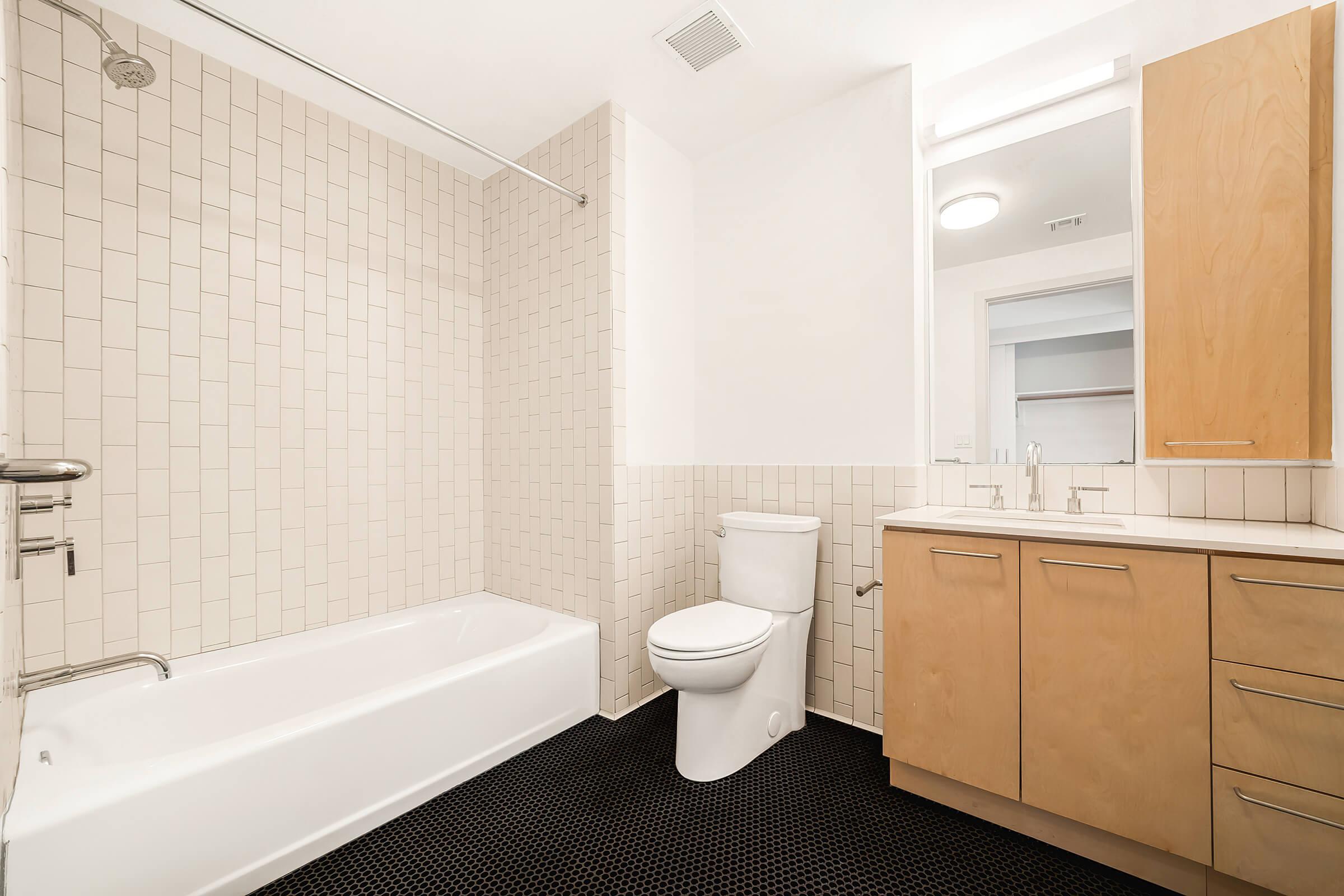 a room with a sink and a shower