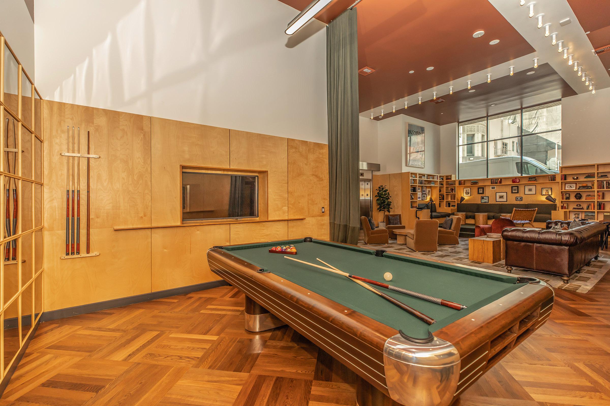 Eastown Apartments community room with a pool table