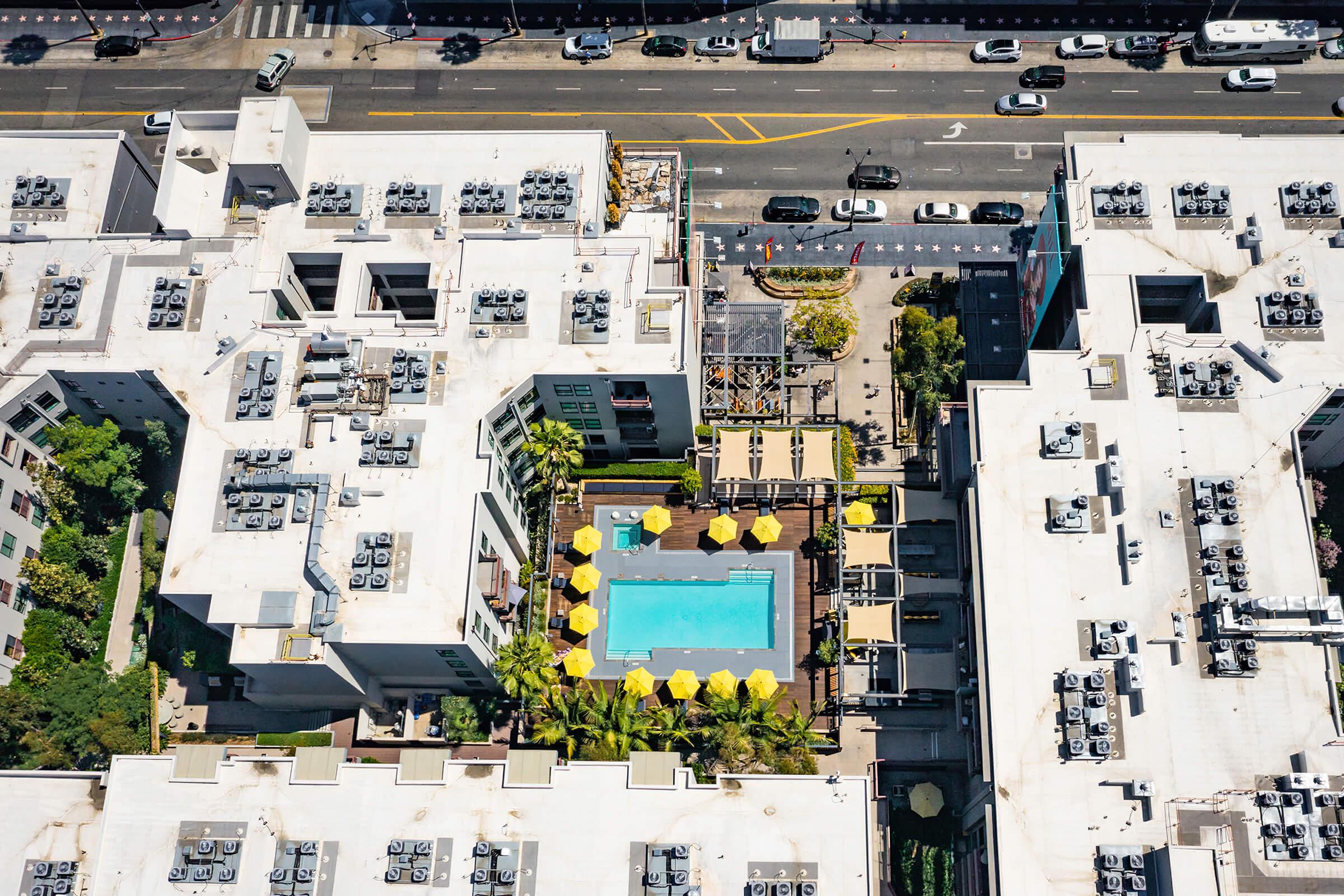 the community pool and apartment buildings from above