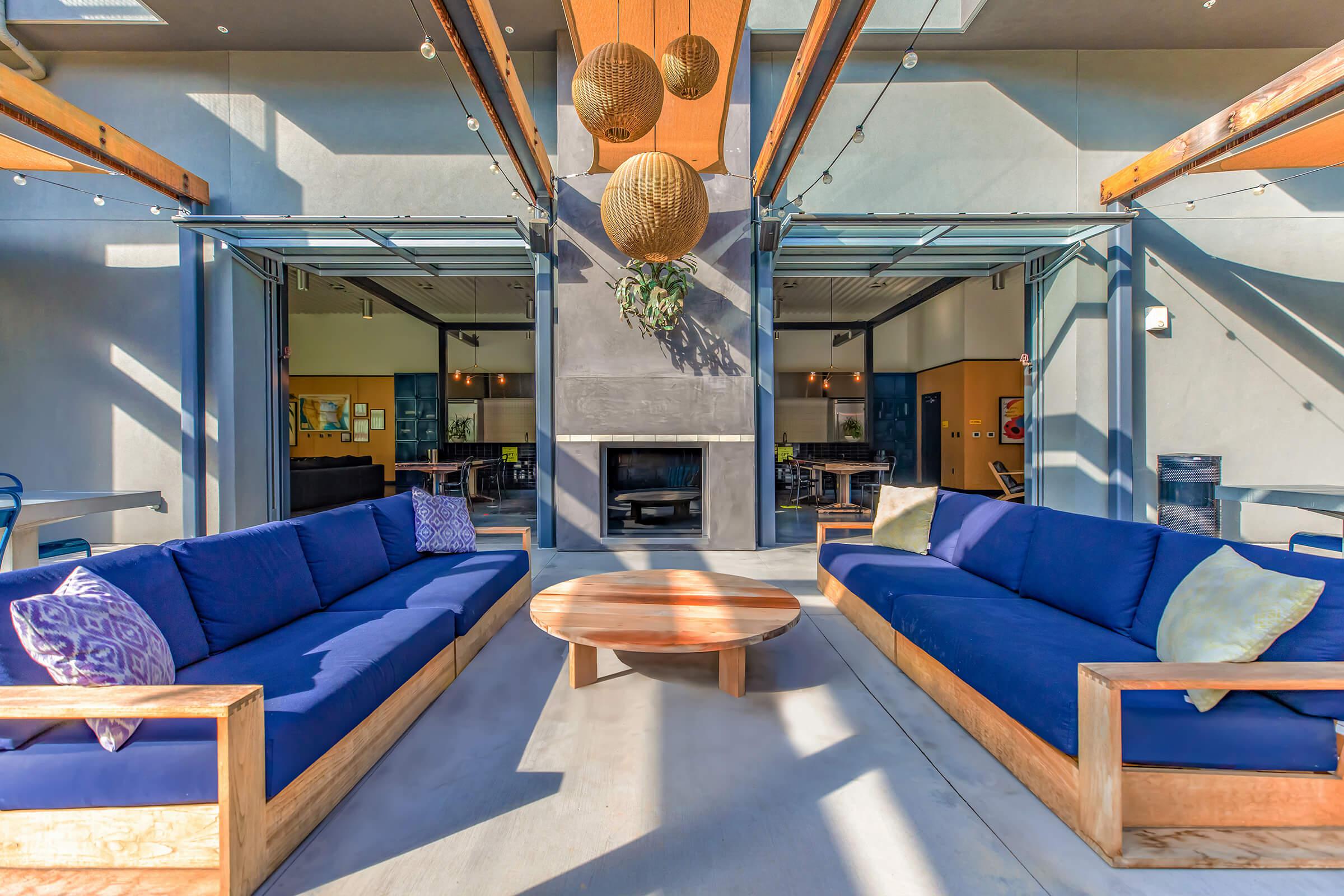 Outdoor seating area with blue couches