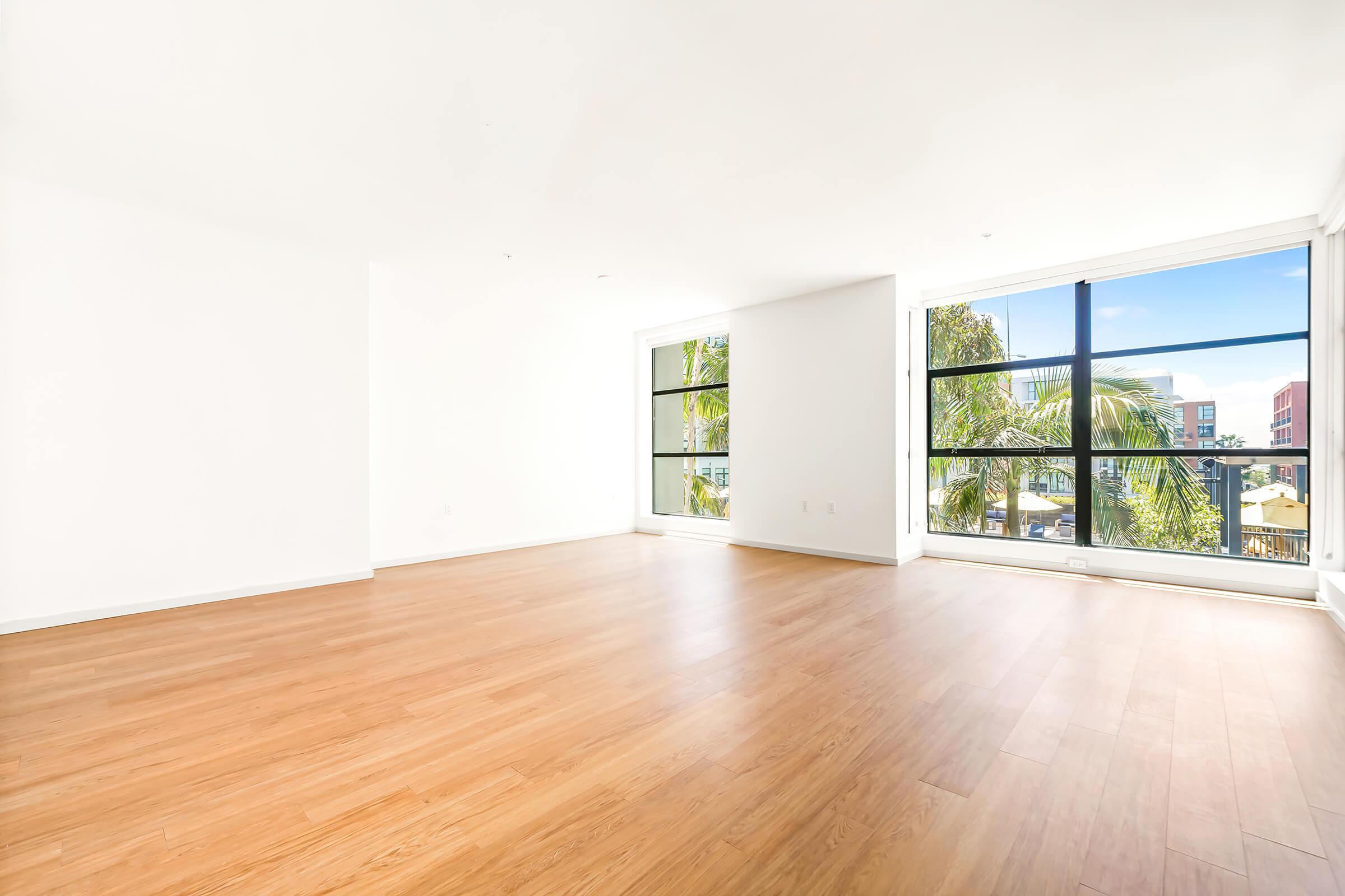 vacant living room with large paned windows