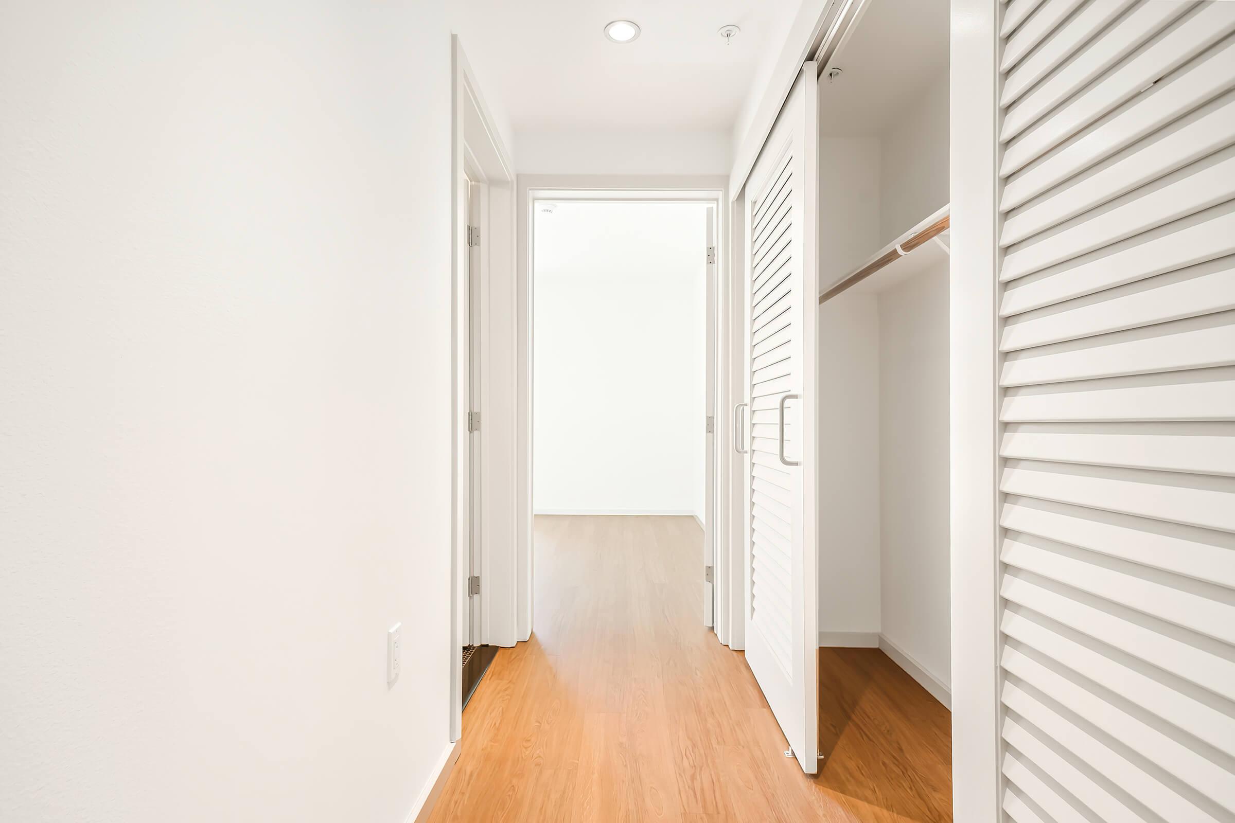 hallway closet with sliding doors