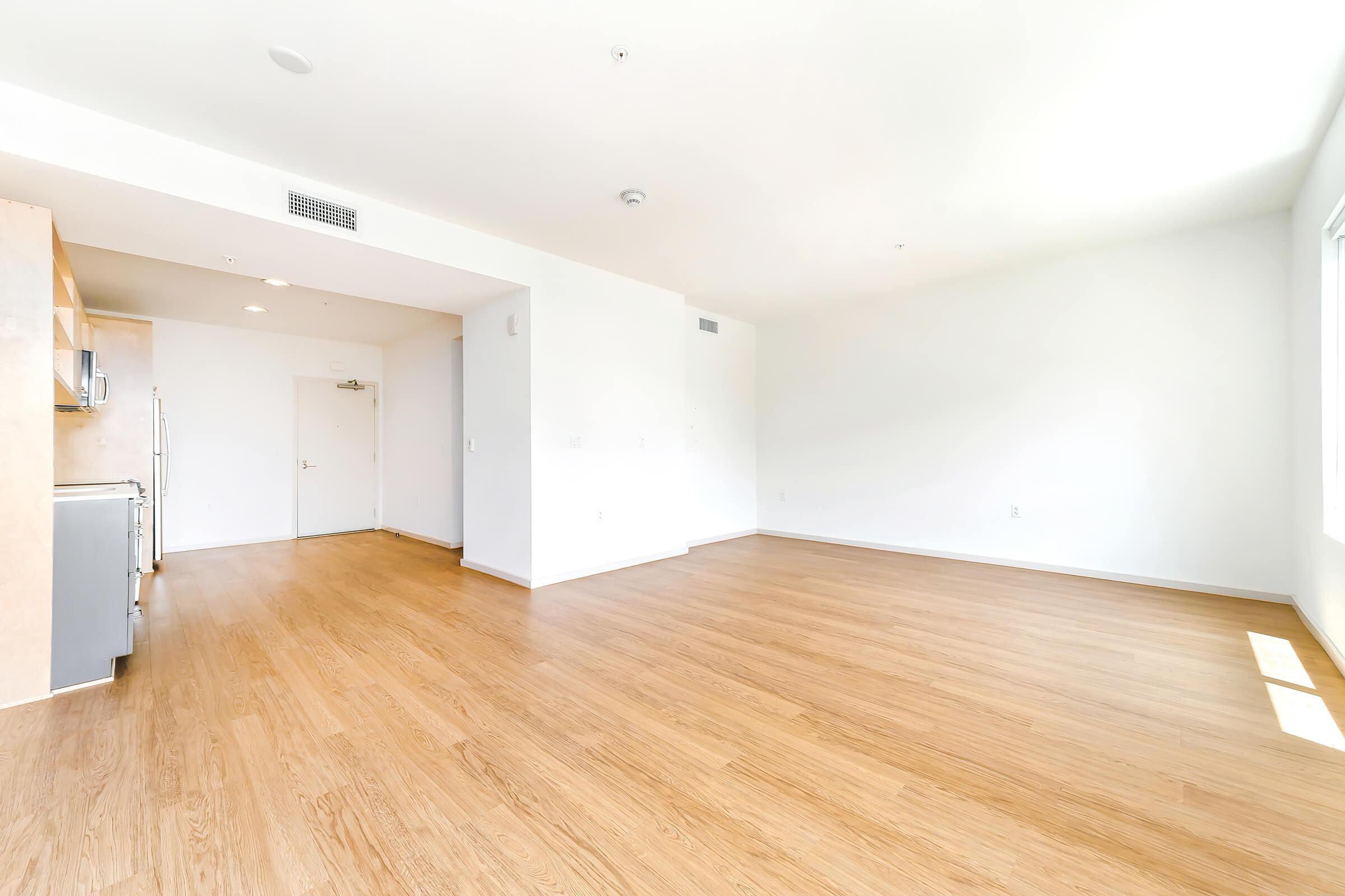 unfurnished apartment with wooden floors