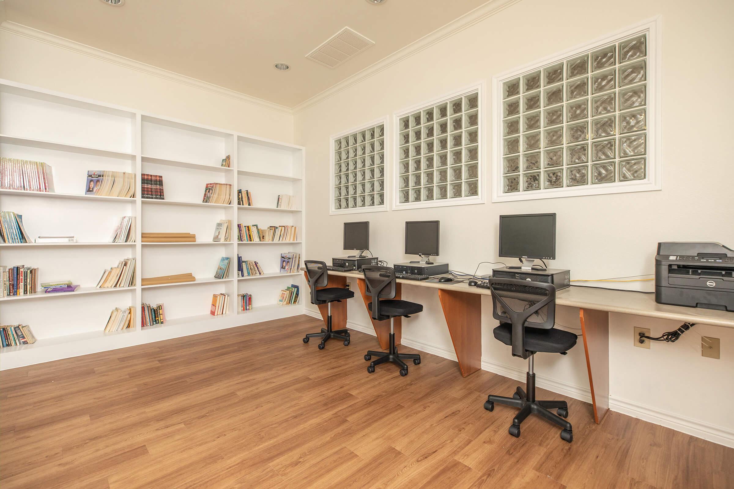 a room filled with furniture and a large window