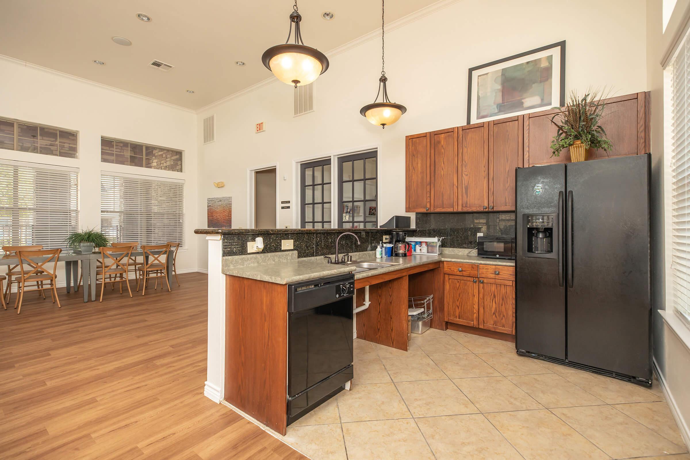 a kitchen with a wood floor