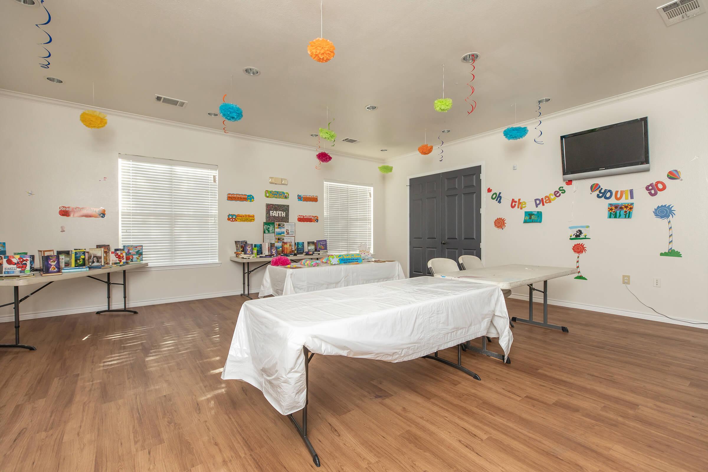 a bedroom with a bed and desk in a room