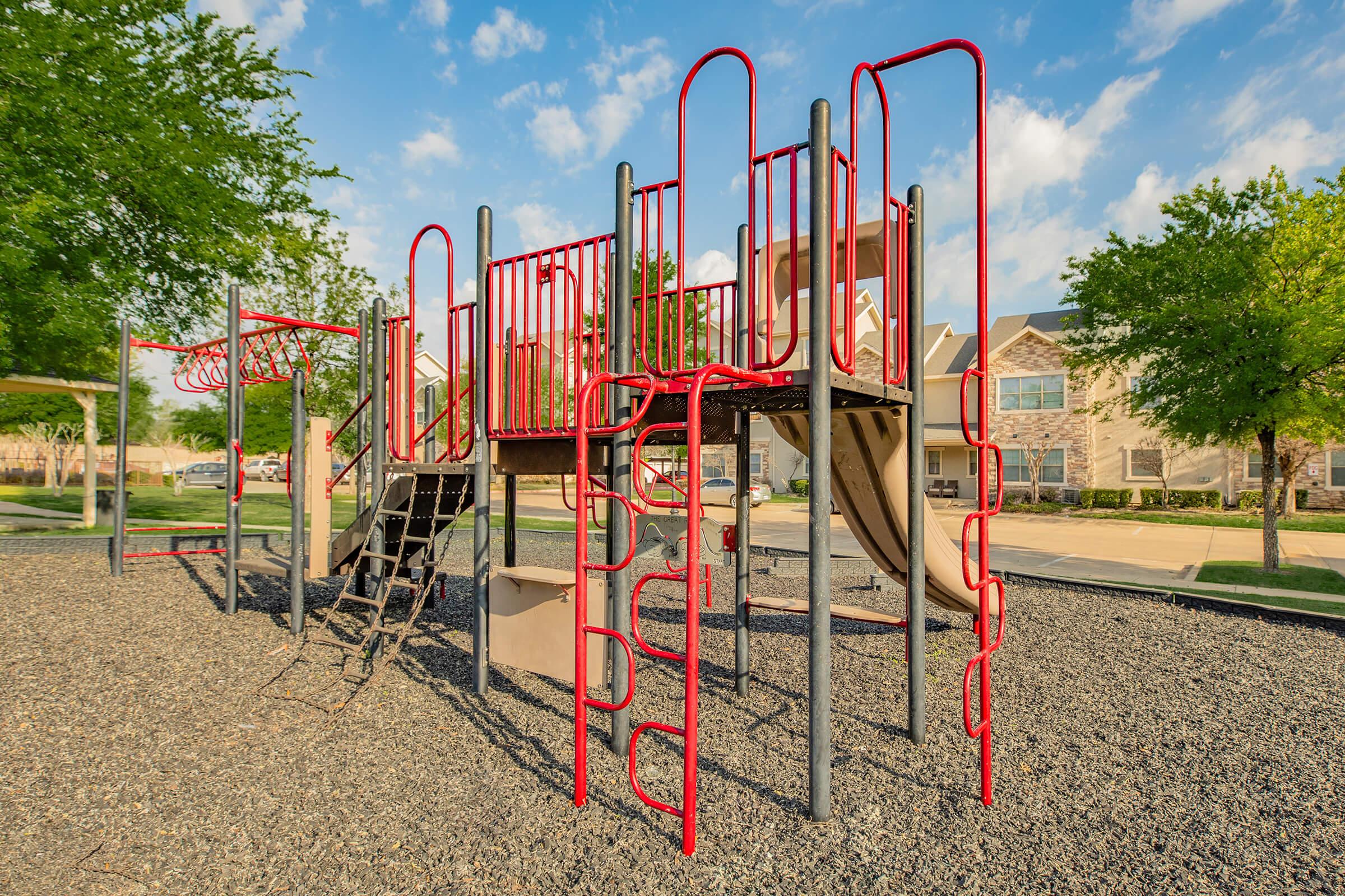 a playground inside a fence