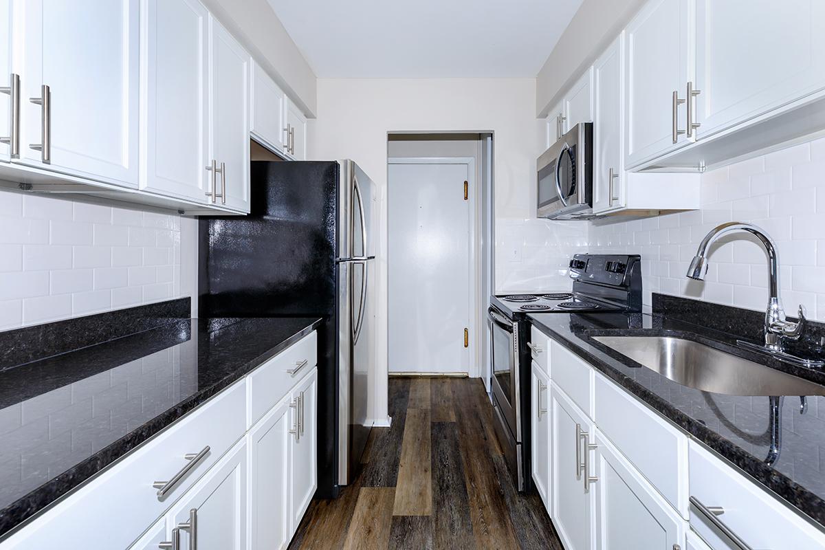 a kitchen with a sink and a window
