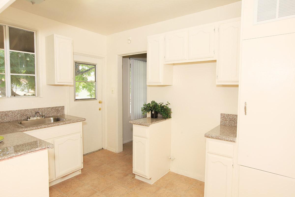 a kitchen with a sink and a window